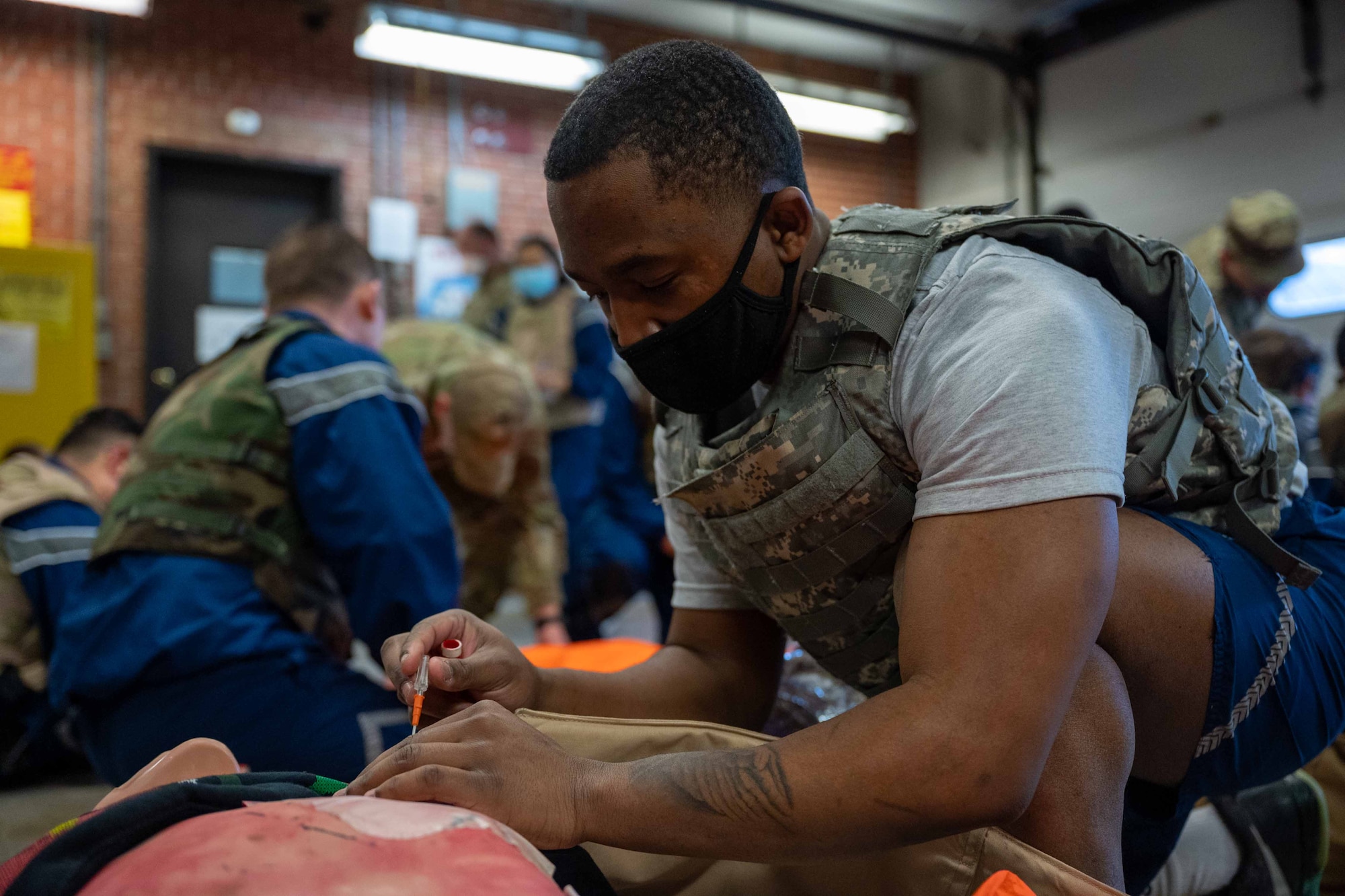 Airman 1st Class Nassir Bowen, 166th Medical Group biomedical equipment apprentice, Delaware Air National Guard, administers a chest needle decompression during a Tactical Combat Casualty Care class at Dover Air Force Base, Delaware, Feb. 18, 2022. Held by the 436th MDG, this is the second TCCC Combat Life-Saver course for medical Airmen who are not frontline responders. During TCCC CLS, Air-men are taught lifesaving skills and tested during a rigorous capstone exercise. (U.S. Air Force photo by Senior Airman Faith Schaefer)