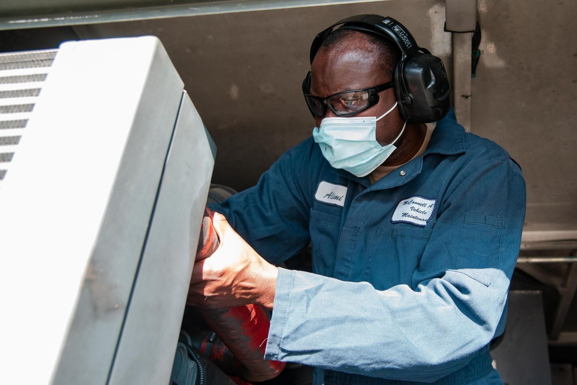 Airman 1st Class Gyanu Alimi inspects a de-icing truck Aug. 26, 2022, at McConnell Air Force Base, Kansas.