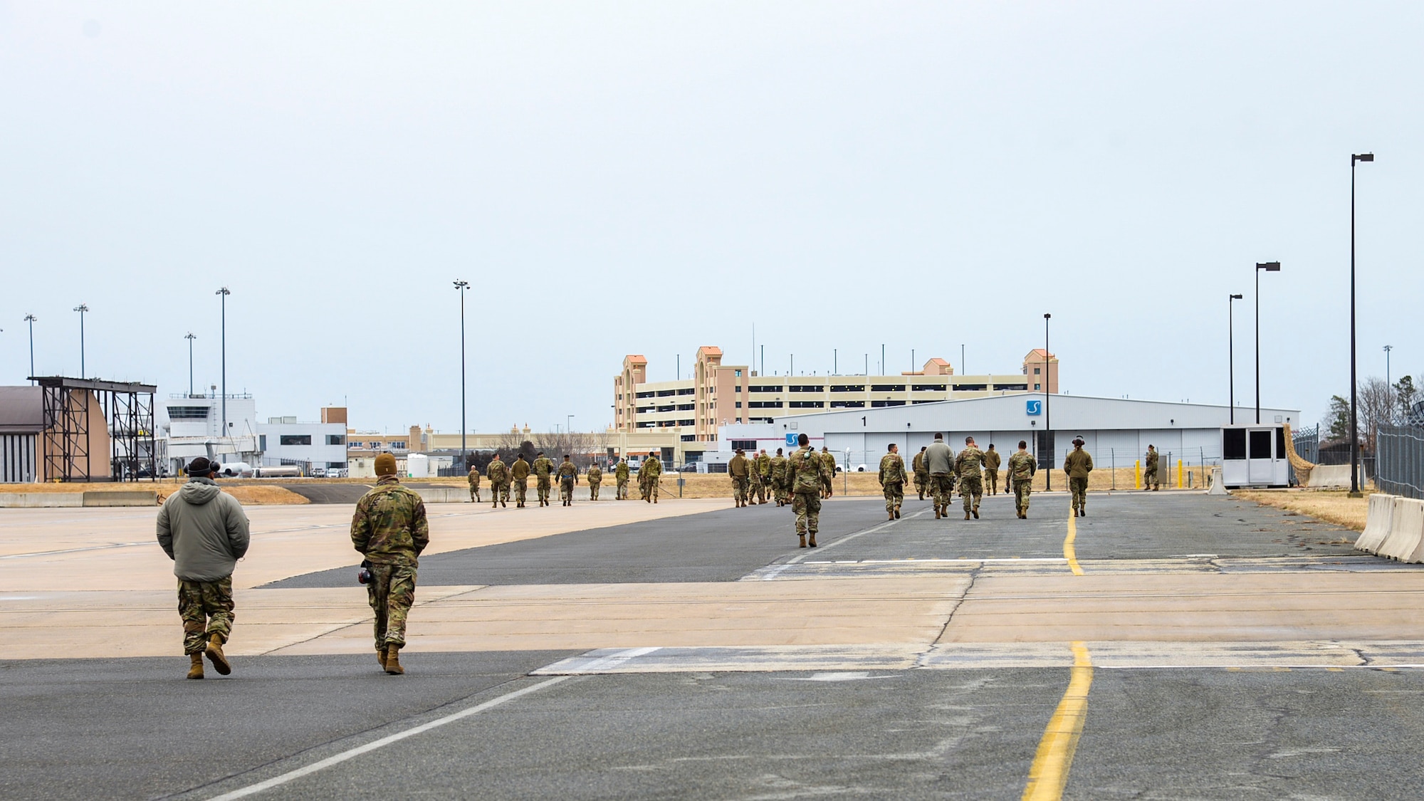 An image of U.S. Air Force maintainers with the 177th Fighter Wing conducting a FOD (Foreign Object Debris) Walk.