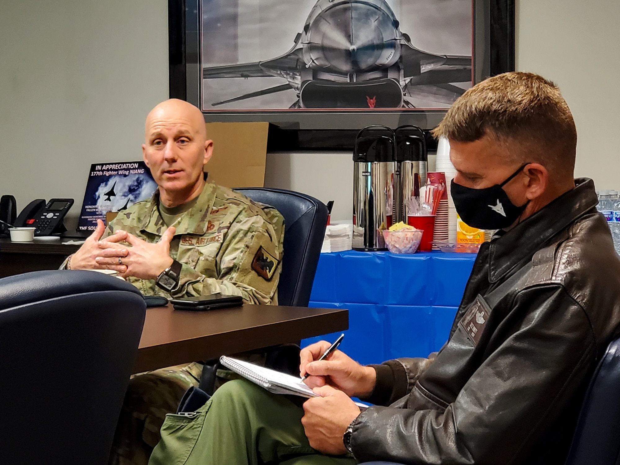 An image of U.S. Air Force Brig. Gen. Donald K. Carpenter, left, director of Logistics, Engineering and Force Protection, National Guard Bureau, and Col. Derek B. Routt, commander of the 177th Fighter Wing of the New Jersey Air National Guard, conducting a briefing.