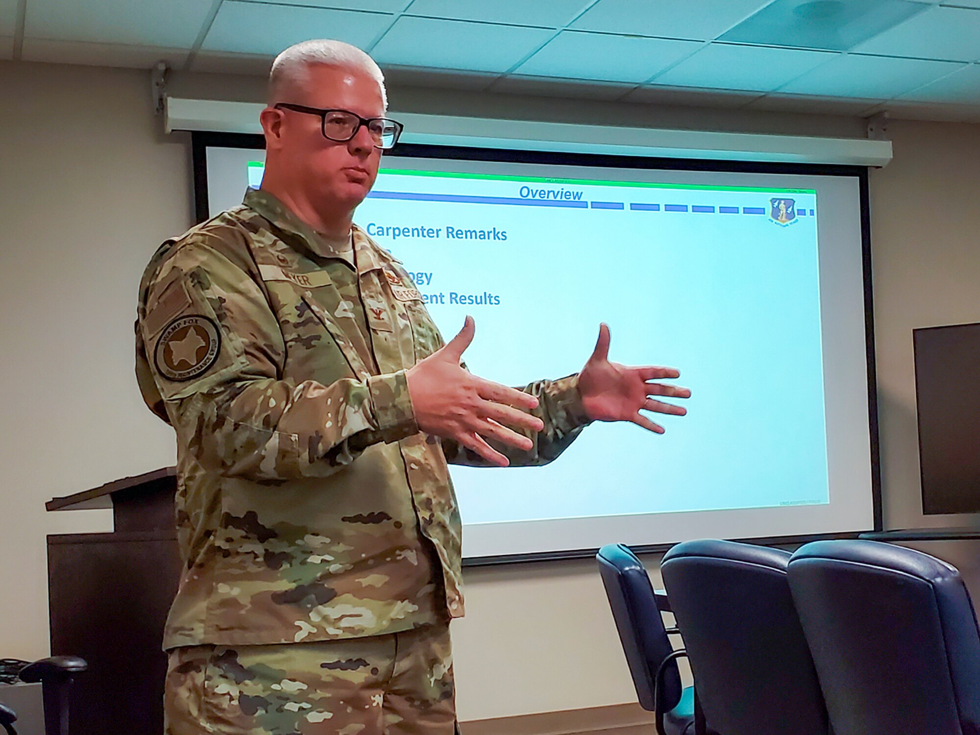 An image of U.S. Air Force Col. Adrian Meyer, Maintenance Group commander with the 169th Fighter Wing, South Carolina Air National Guard, conducting a briefing.