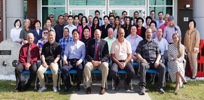 Hyon, Ok Kyong, Far East District program analyst (third from the left in the third row), takes part in a ‘Kodak moment’ with members of the Programs and Project Management Division (PPMD) within Far East District at USAG Humphreys, Pyeongtaek, September 2021. (Courtesy photo)