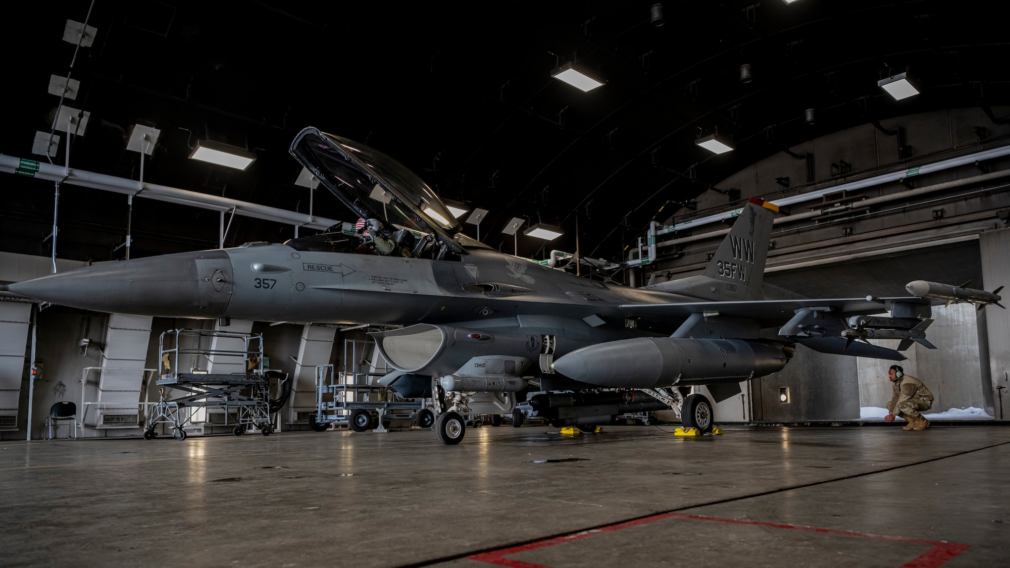 A Jet in an hangar on Misawa Air Base preparing to fly.