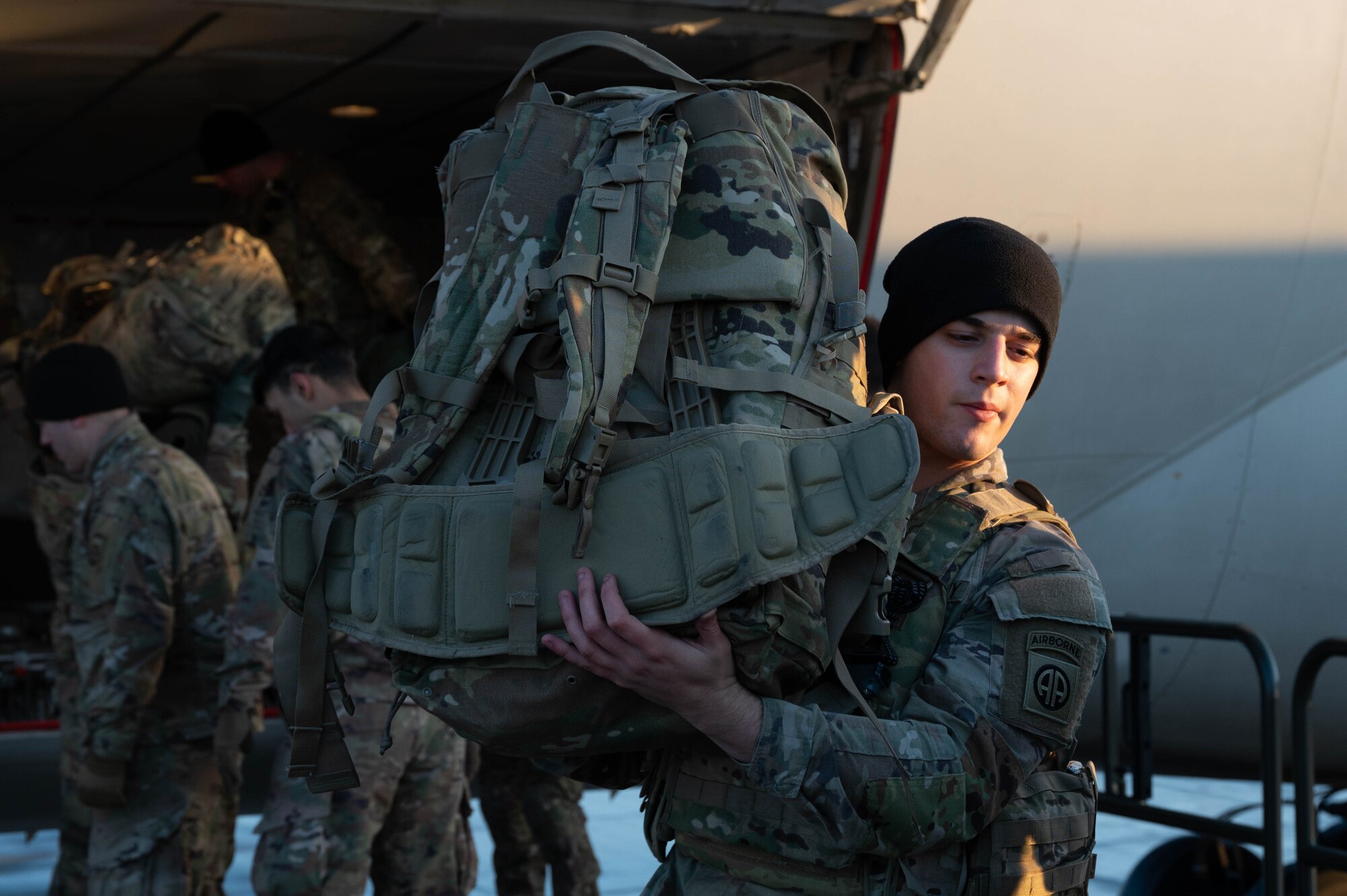 A U.S. Army soldier handles gear at Rzeszow-Jasionka Airport, Poland.