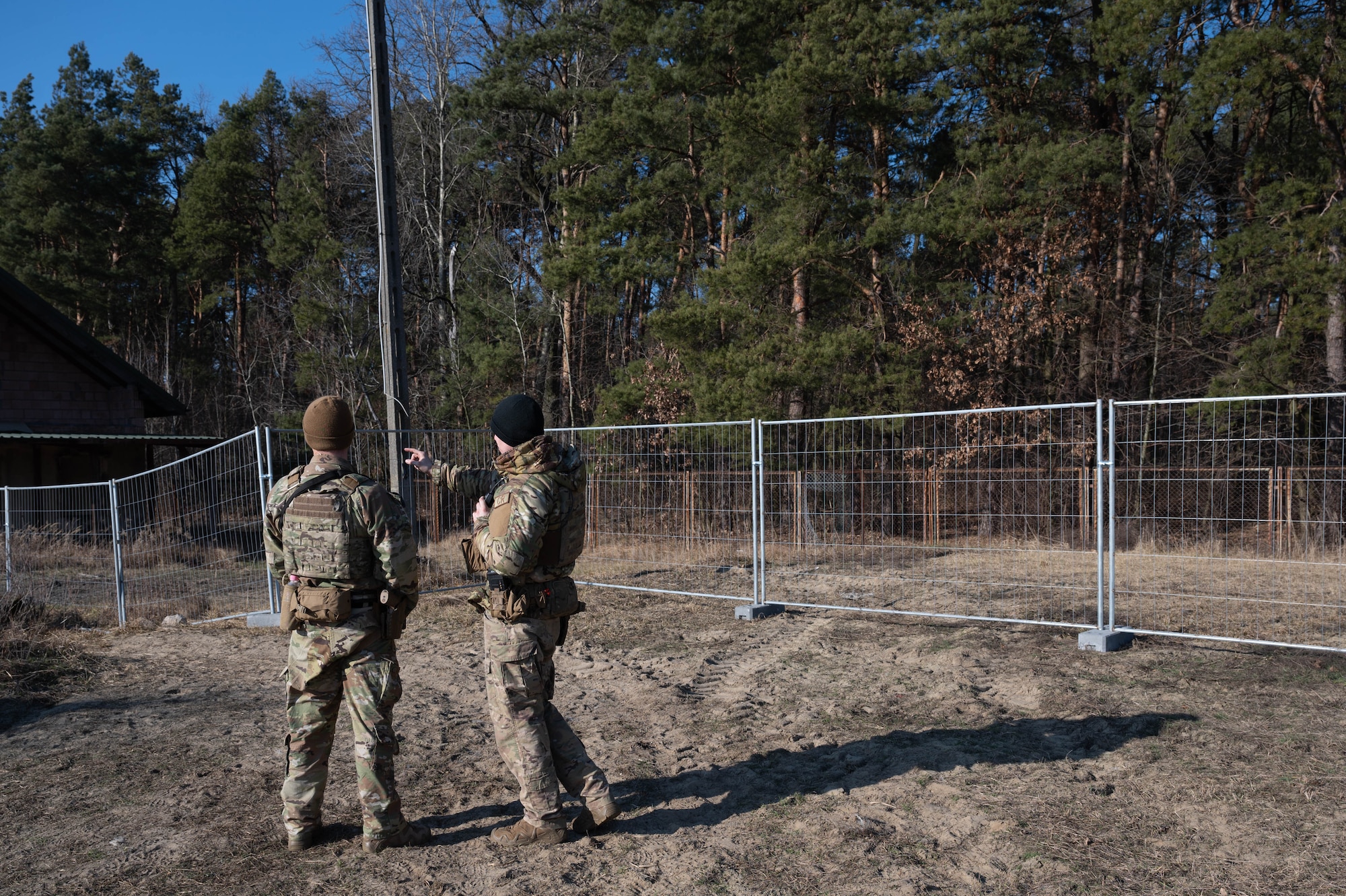 435th SFS defenders discuss perimeter security.