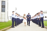 Master Chief Petty Officer Michael P. Leavitt (ret.) and his wife, Debra, depart a change-of-watch ceremony Thursday, May 22, 2014 at Coast Guard Training Center Cape May, N.J. After the change-of watch ceremony, in which Leavitt transferred his duties as MCPOCG to Master Chief Petty Officer Steven W. Cantrell, Leavitt retired following 32 years of Coast Guard service. U.S Coast Guard photo by Petty Officer 3rd Class Cynthia Oldham