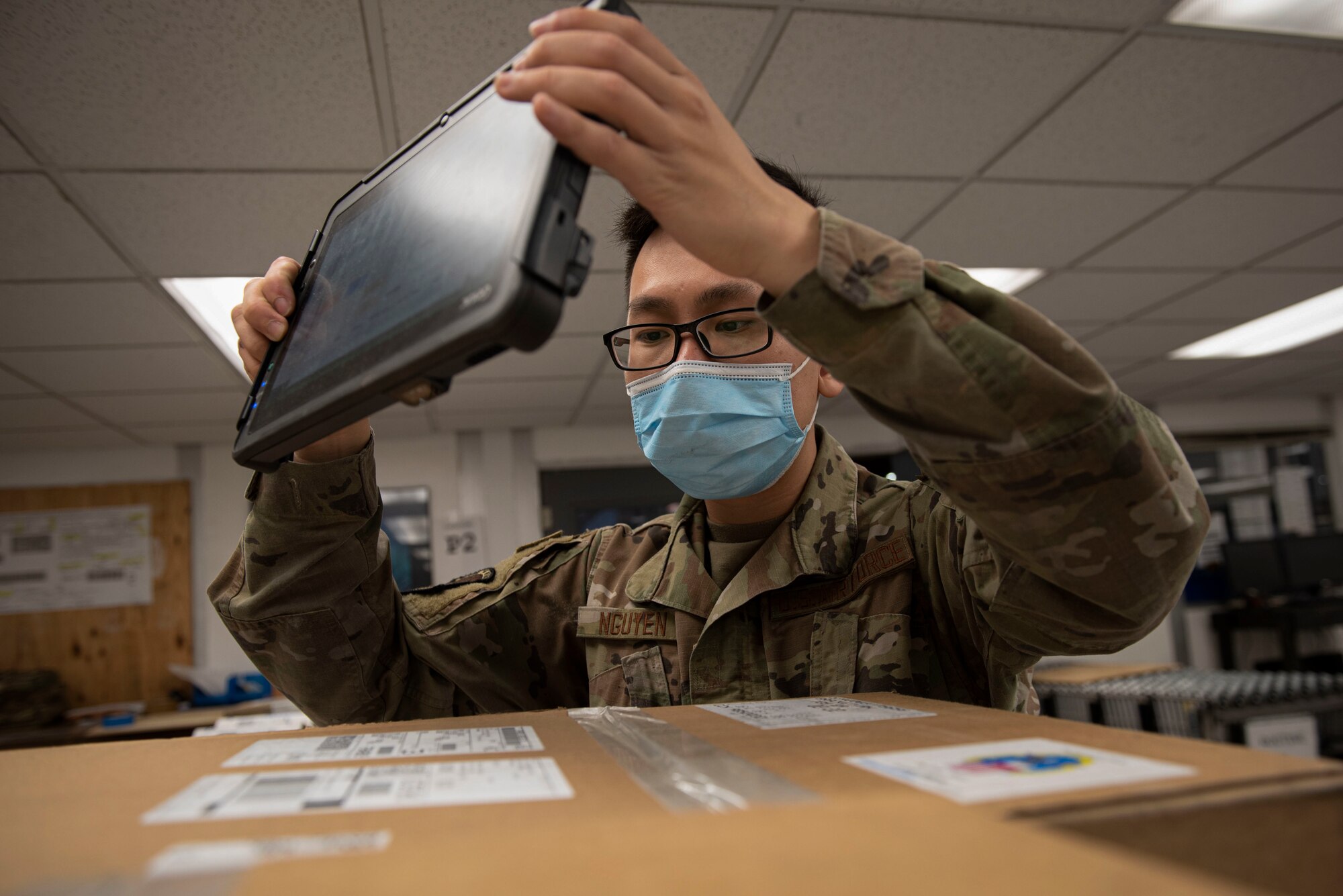 Airman 1st Class Hao Nguyen, 4th Logistics Readiness Squadron Traffic Management Office inbound technician, scans boxes with recently delivered equipment at Seymour Johnson Air Force Base, North Carolina, Feb. 18, 2022. The mission of TMO is to ensure cargo is shipped, sent, or driven to its proper locations in a timely manner. (U.S. Air Force photo by Airman 1st Class Sabrina Fuller)