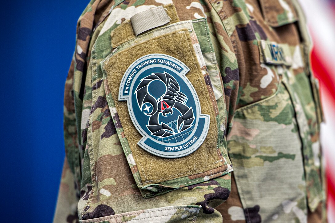 A U.S. Space Force Guardian wears the new unit patch of the 8th Combat Training Squadron after the unit was activated at Schriever Space Force Base, Colorado, Feb. 8, 2022.
