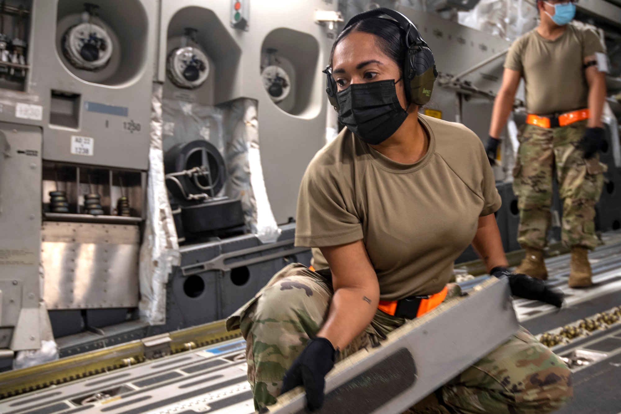 Senior Airman Nigeleene Eltagonde, 48th Aerial Port Squadron (APS), cargo specialist, reconfigures a Hawaii Air National Guard C-17 from the 154th Wing to receive cargo, while at Joint Base Pearl Harbor-Hickam, Jan. 20, 2022.