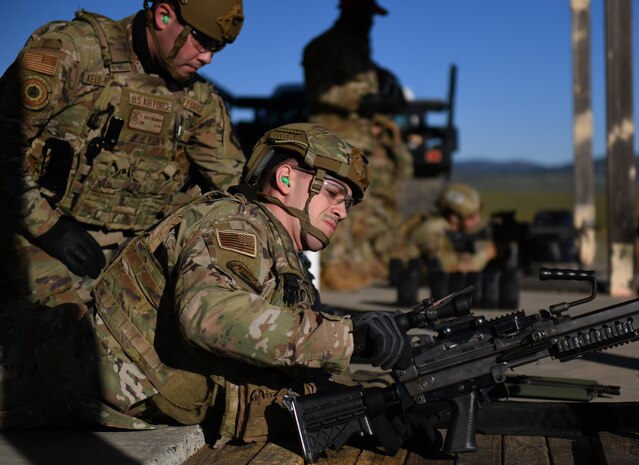 9th Security Forces Squadron (SFS) Airmen prepare to fire weapons Feb. 15, 2022, at Beale Air Force Base, California.