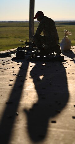 Tech. Sgt. Ji Song, 9th Security Forces Squadron (SFS) combat arms instructor, reloads weapon Feb. 15, 2022, at Beale Air Force Base, California.
