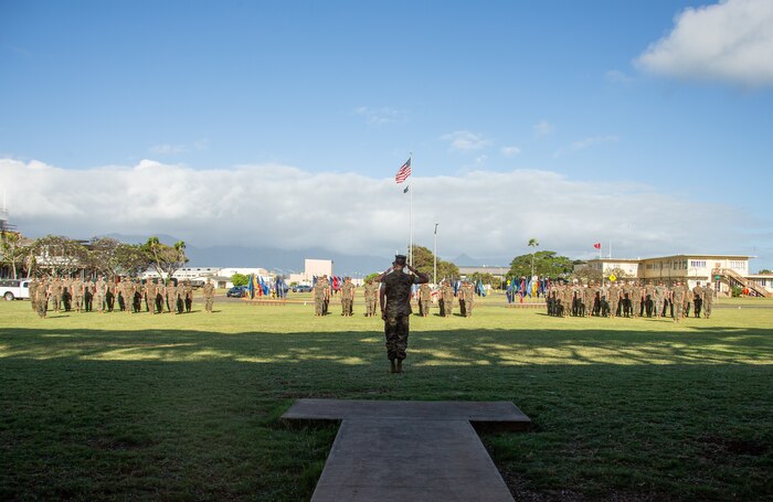 U.S. Marine Corps Capt. David Noble, company commander, Communications Company, 3d Marines, 3d Marine Division salutes the commander of troops during an activation ceremony on Marine Corps Base Hawaii, Feb. 24, 2022. The Communications Company will serve as a critical enabler to the future 3d Marine Littoral Regiment, capable of integrating with the Joint Force, and will provide command and control capabilities to Marines distributed across wide areas of the Indo-Pacific region. (U.S. Marine Corps photo by Sgt. Melanye Martinez)