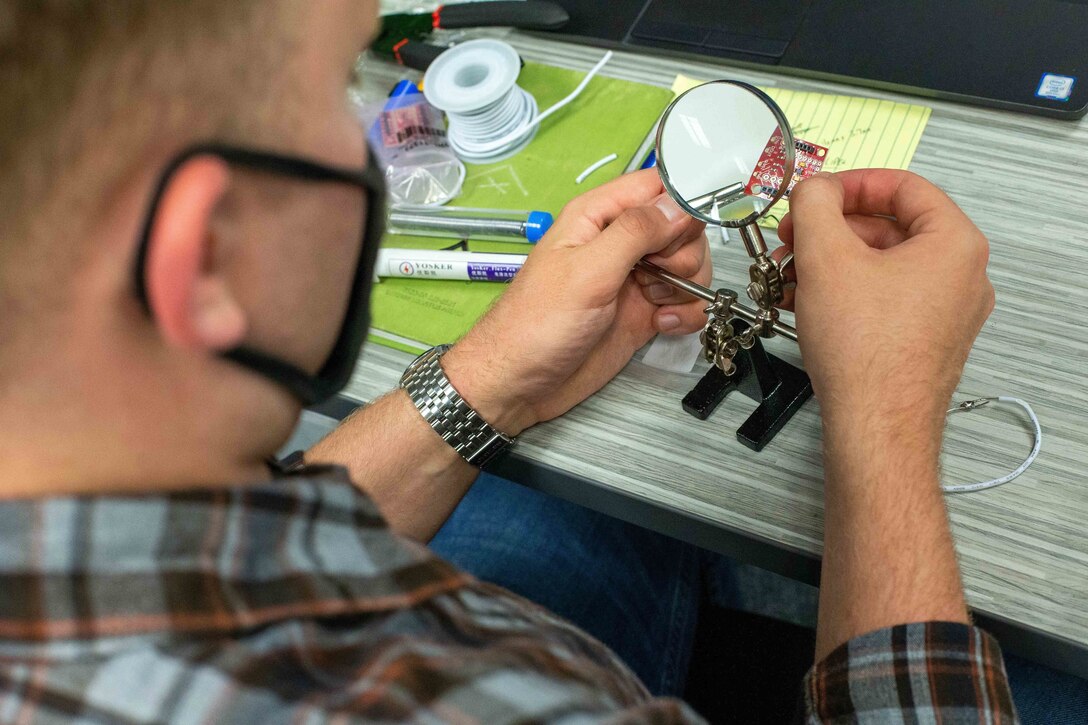 U.S. Marines with I Marine Expeditionary Force Information Group, solder electronic parts during the Building Momentum Innovation Bootcamp at Camp Pendleton, California, Sept. 27, 2021. This event provided I MIG Marines the opportunity to test critical thinking with new technology and enhance unit capabilities with these new skills. (U.S. Marine Corps photo by Cpl. Aidan Hekker)