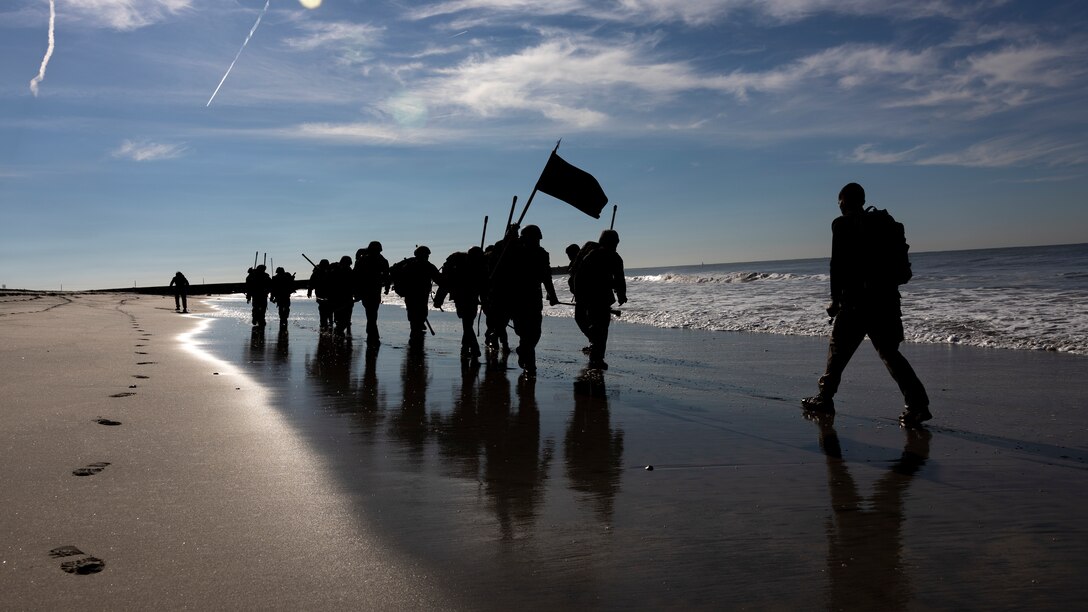 U.S. Marines with I Marine Expeditionary Force Information Group conduct a hike during the culminating event of a Martial Arts Instructor course led by 1st Intelligence Battalion, I MIG on Marine Corps Base Camp Pendleton, California, Dec. 16, 2021. The Marines participated in the MAI course to become instructors where they can train and advance Marines in the Marine Corps Martial Arts Program.  (U.S. Marine Corps photo by Cpl. Austin Gillam)