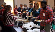 U.S. Army Space and Missile Defense Command volunteers serve Gold Star Families during the Survivor Outreach Services holiday dinner at the Huntsville Botanical Gardens, Nov. 20, 2021. (U.S. Army photo by Carrie David Campbell)
