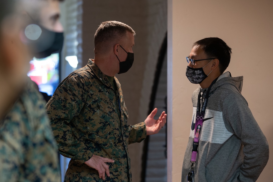 U.S. Marine Brig. Gen. Jason Woodworth, the commanding general of Marine Corps Installations West, Marine Corps Base Camp Pendleton, answers questions for a Camp Pendleton resident at the Base Housing Quality of Life open house at Marine Corps Family Team Building Center on Marine Corps Base Camp Pendleton, California, Feb. 23, 2022. The open house was held to increase awareness of current procedures, services and various resources available to residents along with addressing housing related questions or concerns. (U.S. Marine Corps photo by Lance Cpl. Mhecaela J. Watts)