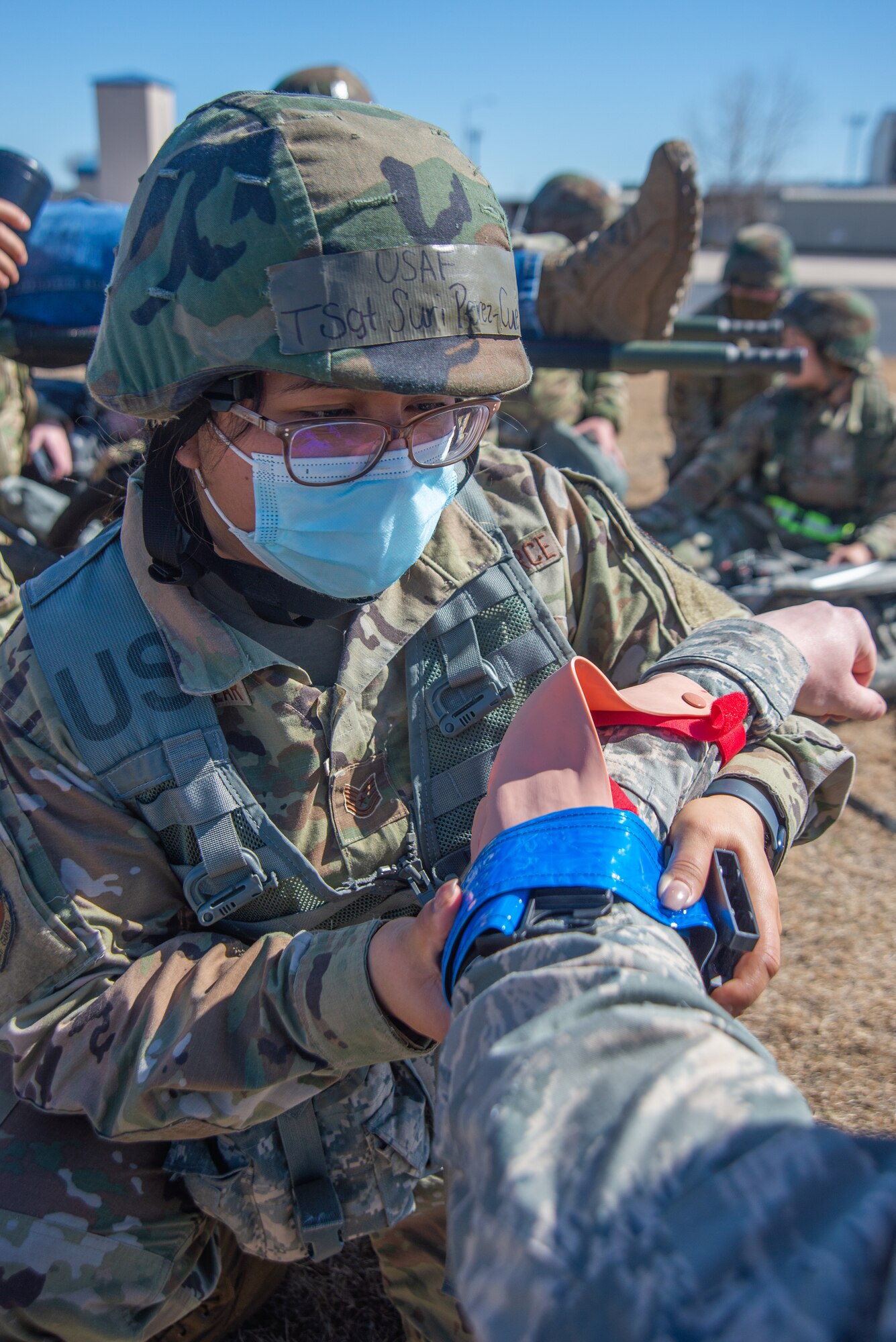 Airman tends to a synthetic arm injury.