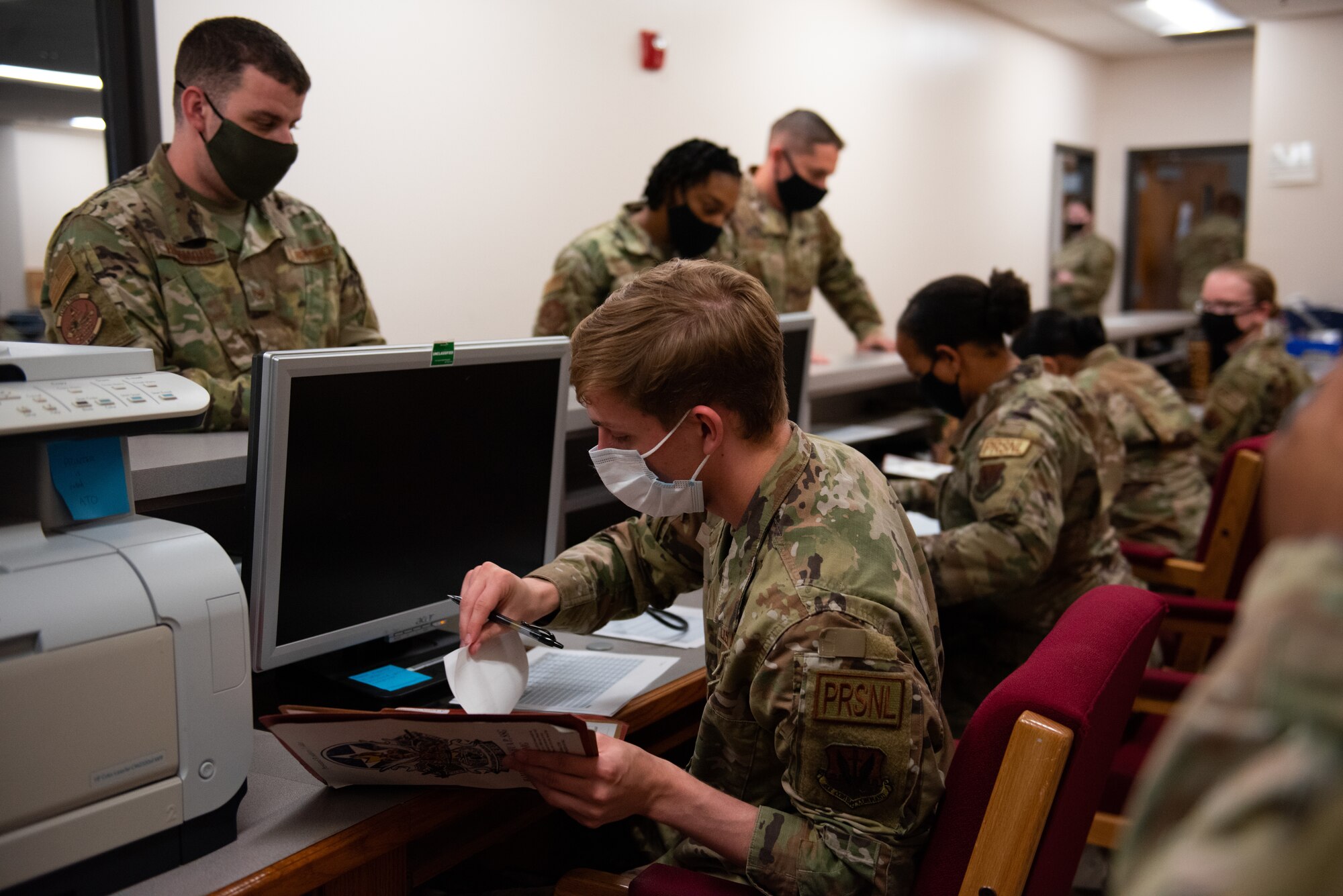 Photo of Airmen standing in line