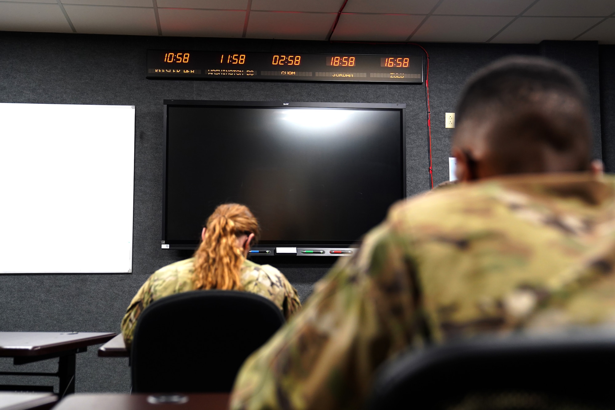 334th Training Squadron students attend a command post operations class inside a classroom dedicated to Master Sgt. Desiree McIntyre, 403rd Wing command and control technician, located in Cody Hall at Keesler Air Force Base, Mississippi, Feb. 25, 2021. McIntyre dedicated 30 years to the command post career field, providing instrumental training techniques and developing the training curriculum. (U.S. Air Force photo by Senior Airman Seth Haddix)