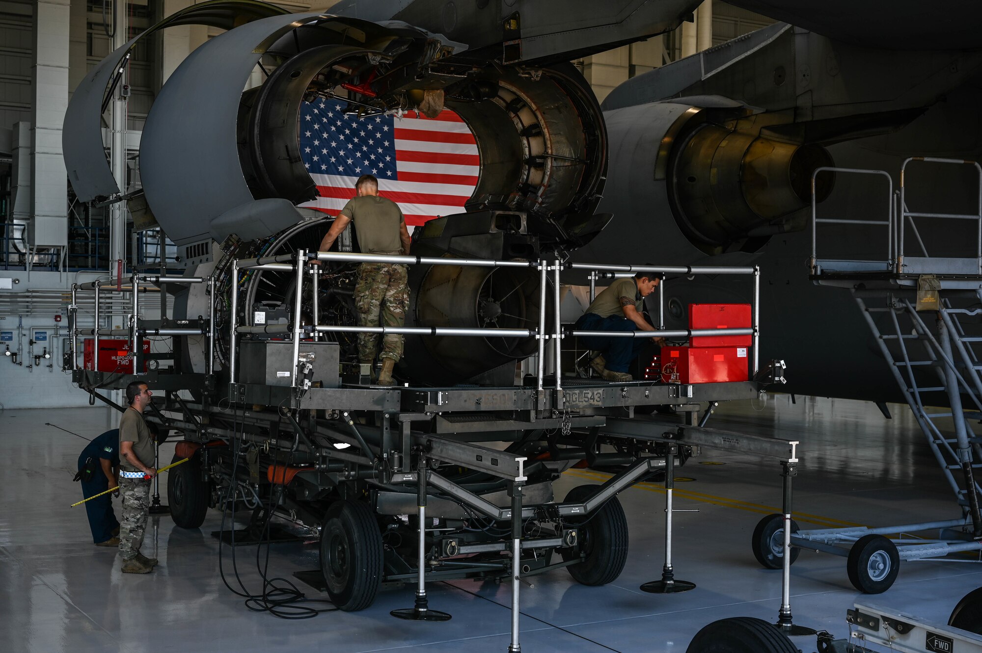 Airmen assigned to the 15th Maintenance Group and 154th Aircraft Maintenance Squadron prepare a C-17 Globemaster III turbofan engine for an engine swap in Hangar 19 on Joint Base Pearl Harbor-Hickam, Hawaii, Feb. 23, 2022. Airmen from the 15th MXG and 154th AMXS execute total force integration by working together to carry out the mission.  (U.S. Air Force photo by Staff Sgt. Alan Ricker)