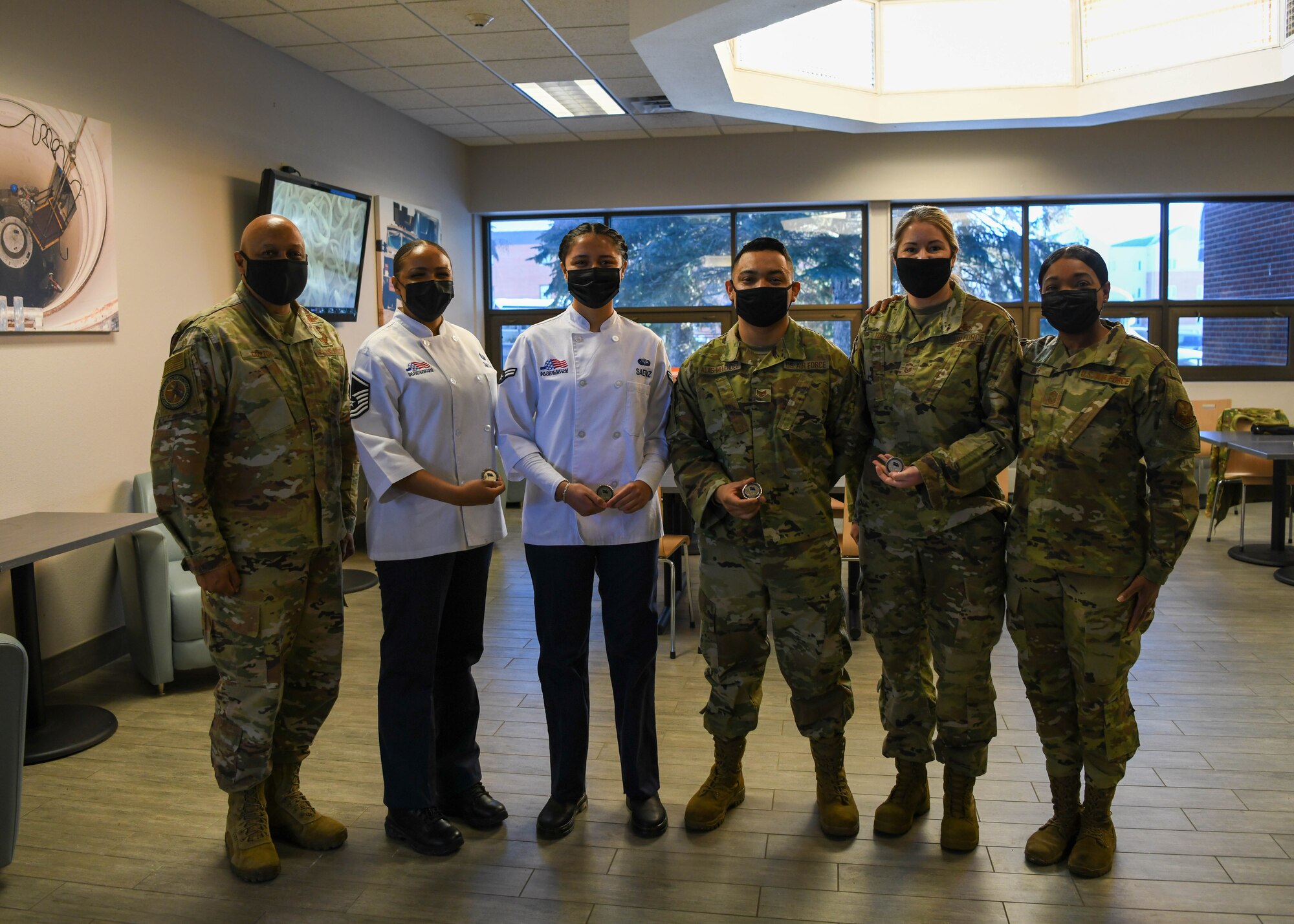 Team Minot Airmen stand with Gen. Anthony Cotton, Air Force Global Strike Command commander and Chief Master Sergeant Melvina Smith, AFGSC command chief at Minot Air Force Base, North Dakota, Feb 24, 2022. (U.S. Air Force photo by Airman 1st Class Evan Lichtenhan)