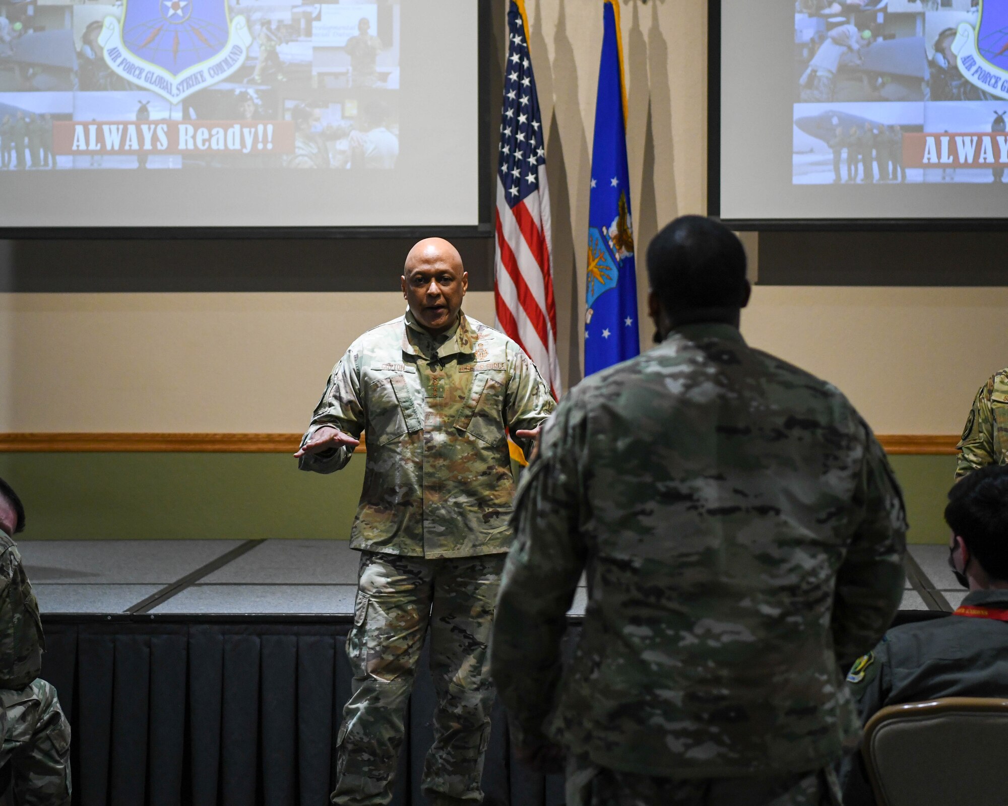 Gen. Anthony Cotton, Air Force Global Strike Command commander, answers a question from Tech. Sgt. Christopher Moore 91st Security Forces Group defender, at an all call at Minot Air Force Base, North Dakota, Feb 23, 2022. While visiting Minot Air Force Base, Gen. Cotton conversed with airmen and leaders about their experiences protecting, interacting and maintaining assets in order to make informed integrated decisions for modernization programs. (U.S. Air Force photo by Airman 1st Class Evan Lichtenhan