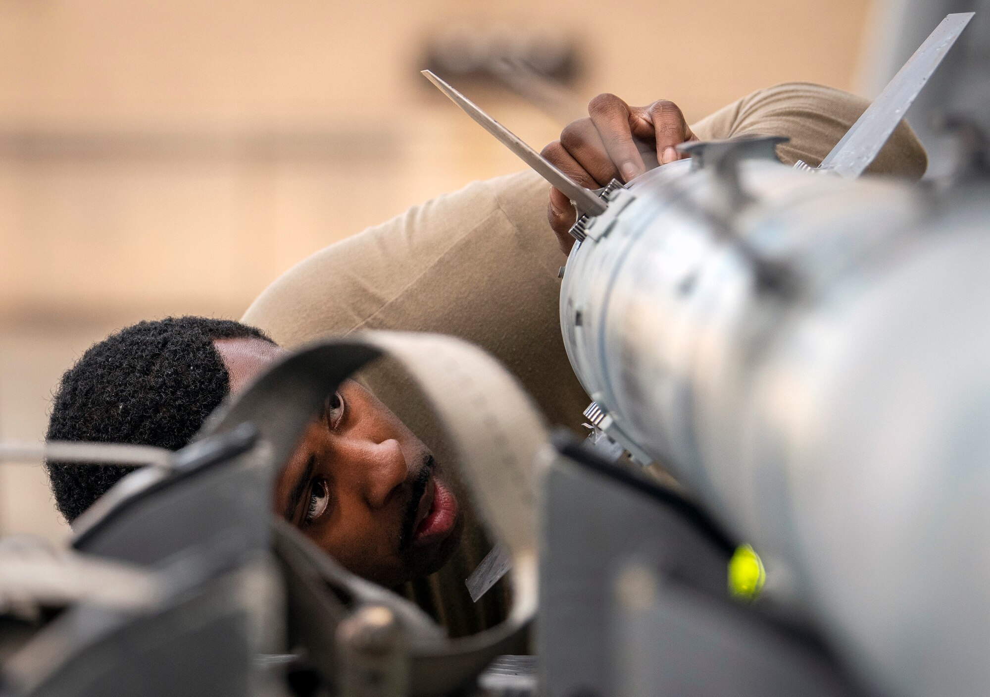 Staff Sgt. Donoven Wright, 43rd Fighter Generation Squadron, checks AIM-120