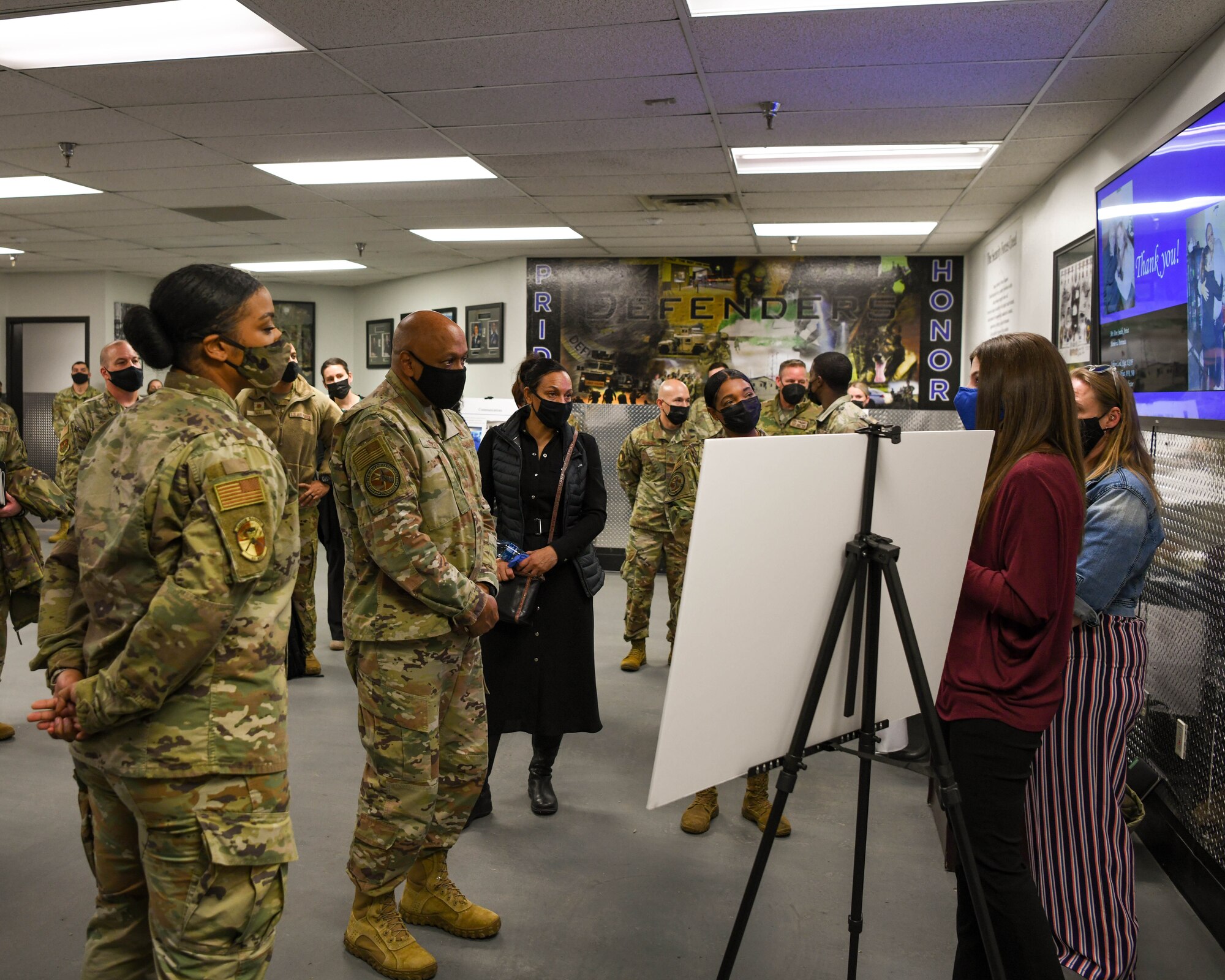Gen. Anthony Cotton, Air Force Global Strike Command commander and Chief Master Sergeant Melvina Smith AFGSC command chief, visits with security forces Airmen at Minot Air Force Base, North Dakota, Feb 24, 2022. While touring, Gen. Cotton and Chief Smith discussed the many programs spouses at Minot AFB have organized to foster a relationship between Airmen, and how the command could continue to support them (U.S. Air Force photo by Airman 1st Class Evan Lichtenhan)