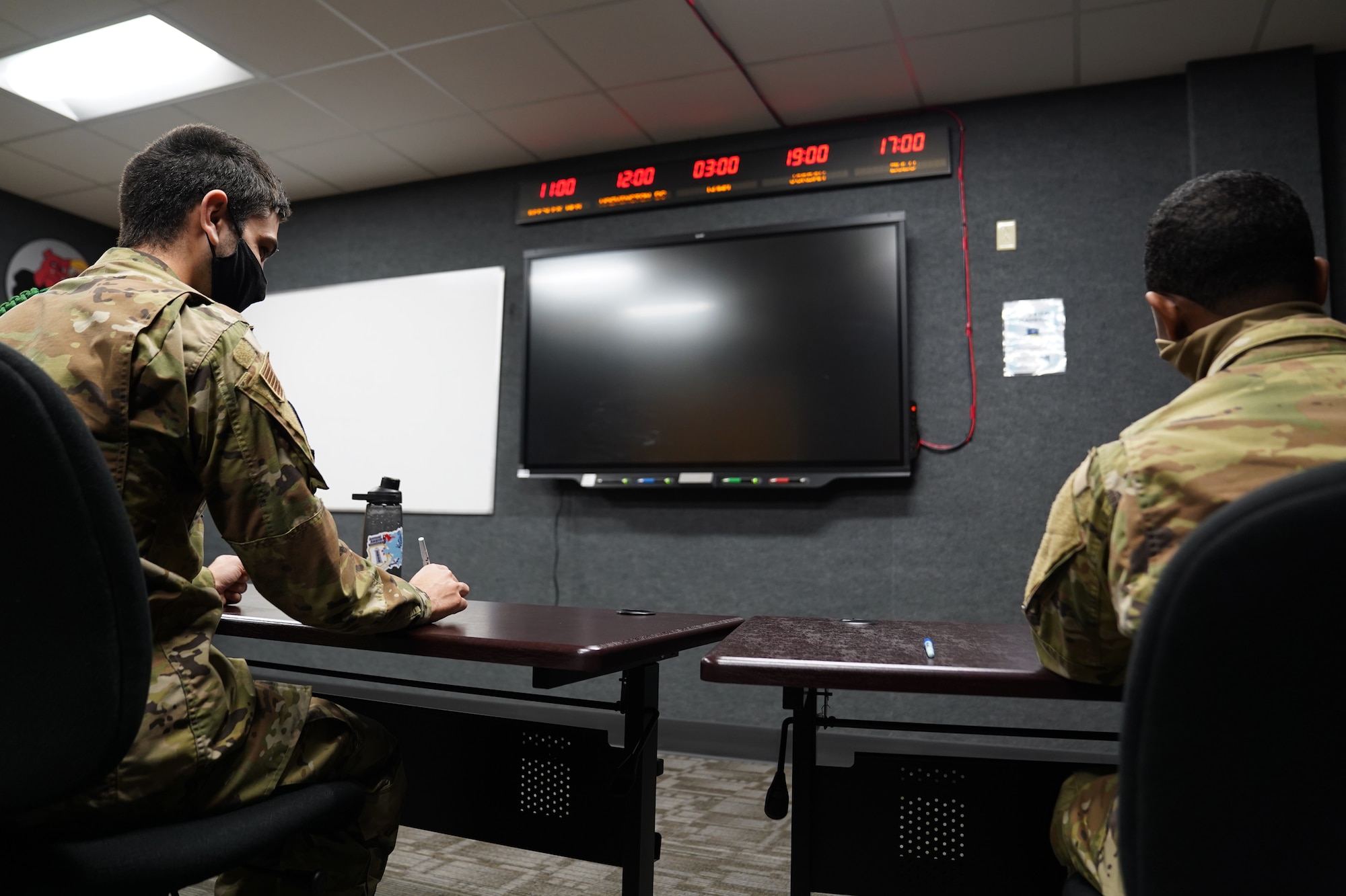 334th Training Squadron students attend a command post operations class inside a classroom dedicated to Master Sgt. Desiree McIntyre, 403rd Wing command and control technician, located in Cody Hall at Keesler Air Force Base, Mississippi, Feb. 25, 2021. McIntyre dedicated 30 years to the command post career field, providing instrumental training techniques and developing the training curriculum. (U.S. Air Force photo by Senior Airman Seth Haddix)