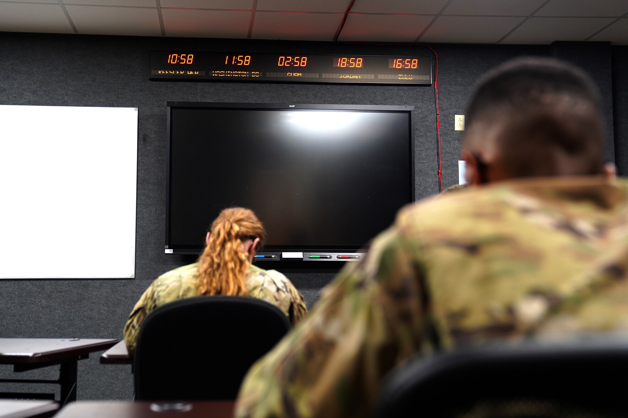 334th Training Squadron students attend a command post operations class inside a classroom dedicated to Master Sgt. Desiree McIntyre, 403rd Wing command and control technician, located in Cody Hall at Keesler Air Force Base, Mississippi, Feb. 25, 2021. McIntyre dedicated 30 years to the command post career field, providing instrumental training techniques and developing the training curriculum. (U.S. Air Force photo by Senior Airman Seth Haddix)