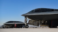 Three B-2 Spirits sit on the Nellis Air Force Base flightline.
