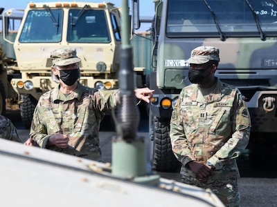 U.S. Air Force Maj. Gen. Sherrie L. McCandless, commanding general, District of Columbia National Guard (left), inspects vehicles assigned to the 74th Military Police Company at Joint Base Anacostia-Bolling, Feb. 25, 2022. 400 District of Columbia National Guard members have been activated to support municipal and federal law enforcement agencies in advance of anticipated First Amendment demonstrations. (U.S. Air National Guard photo by Tech. Sgt. Andrew Enriquez)