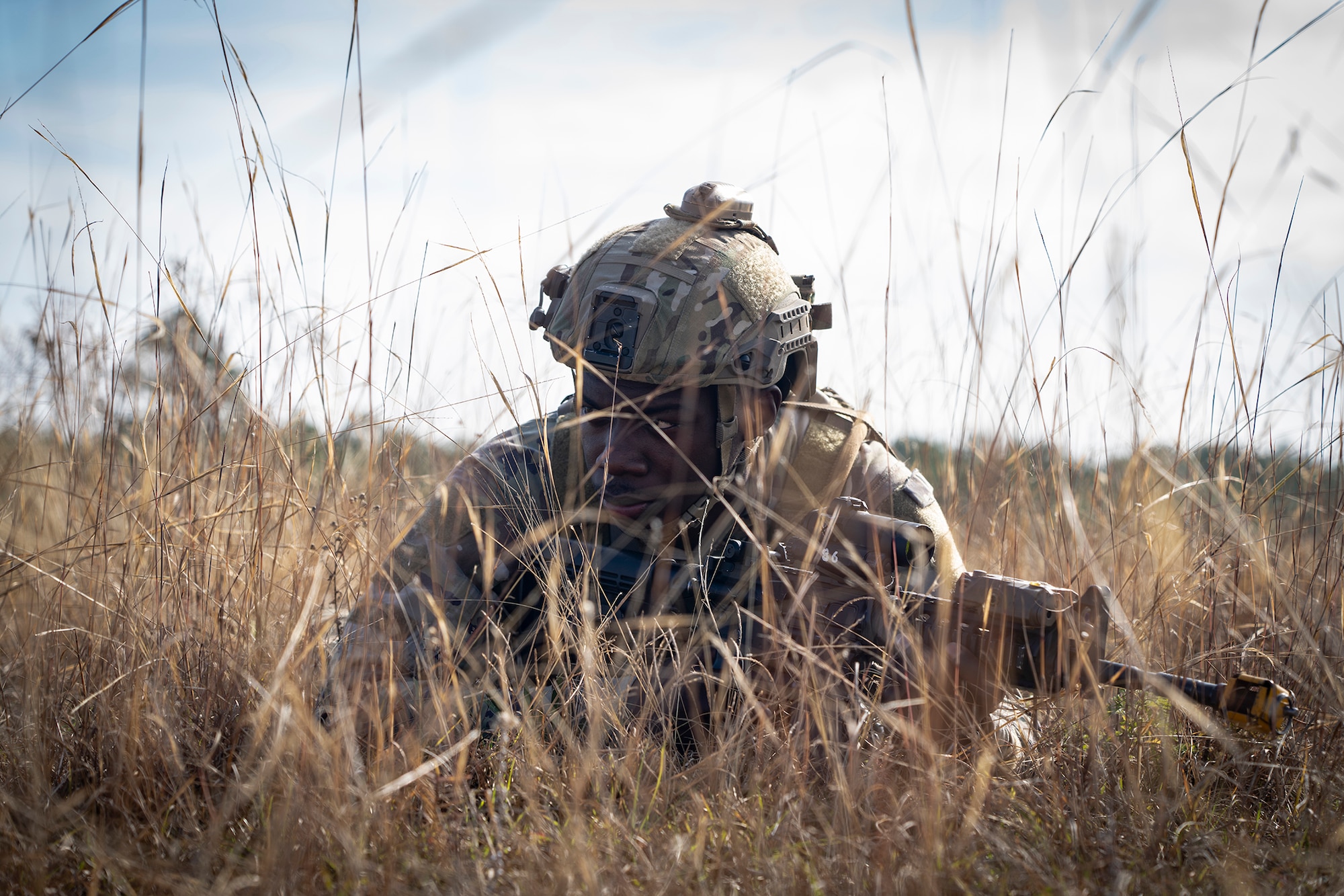 Airman hides in tall grass