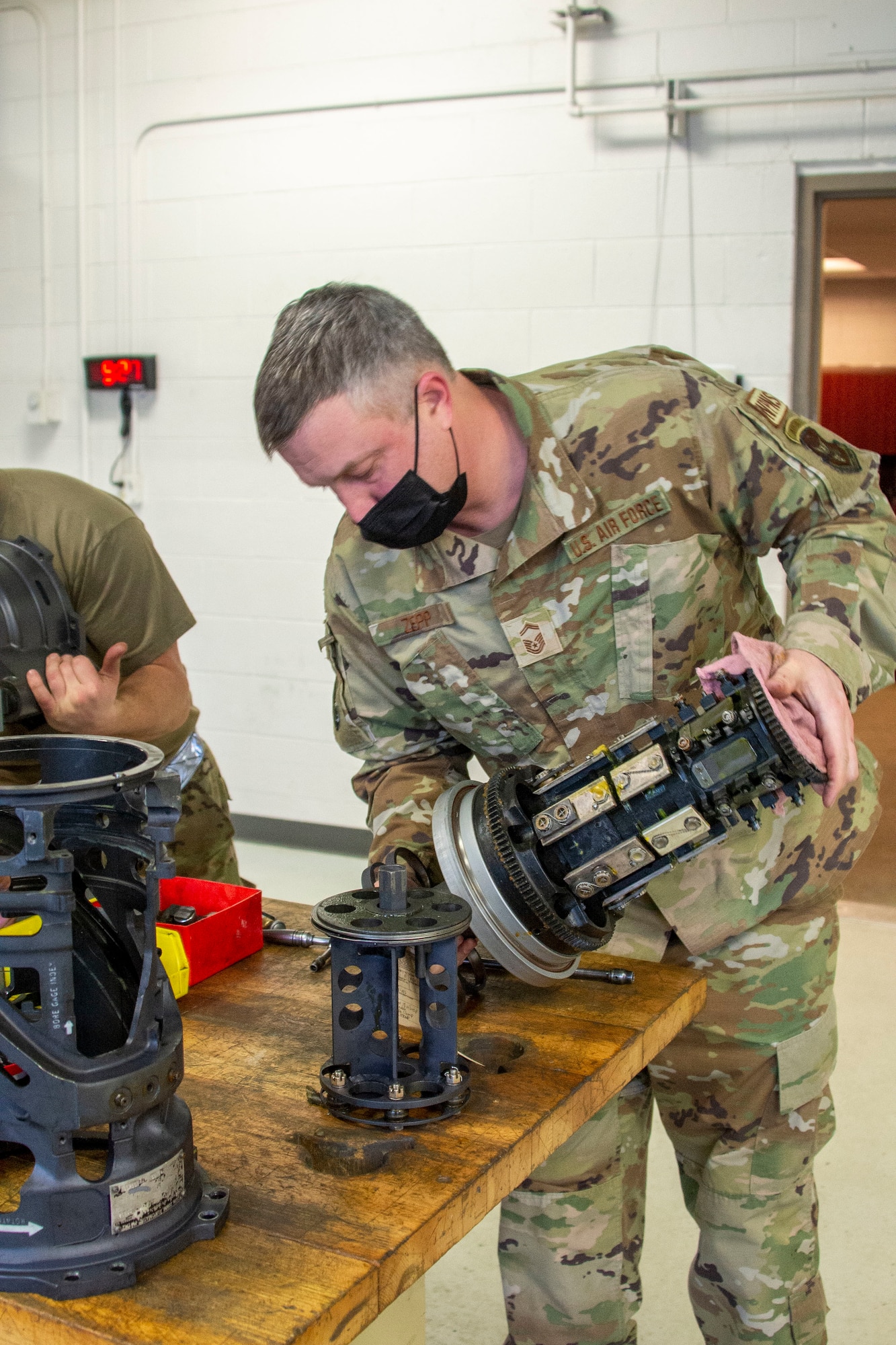 Senior Master Sgt. Ryan Zepp inspects a M61A2 Gatling gun.