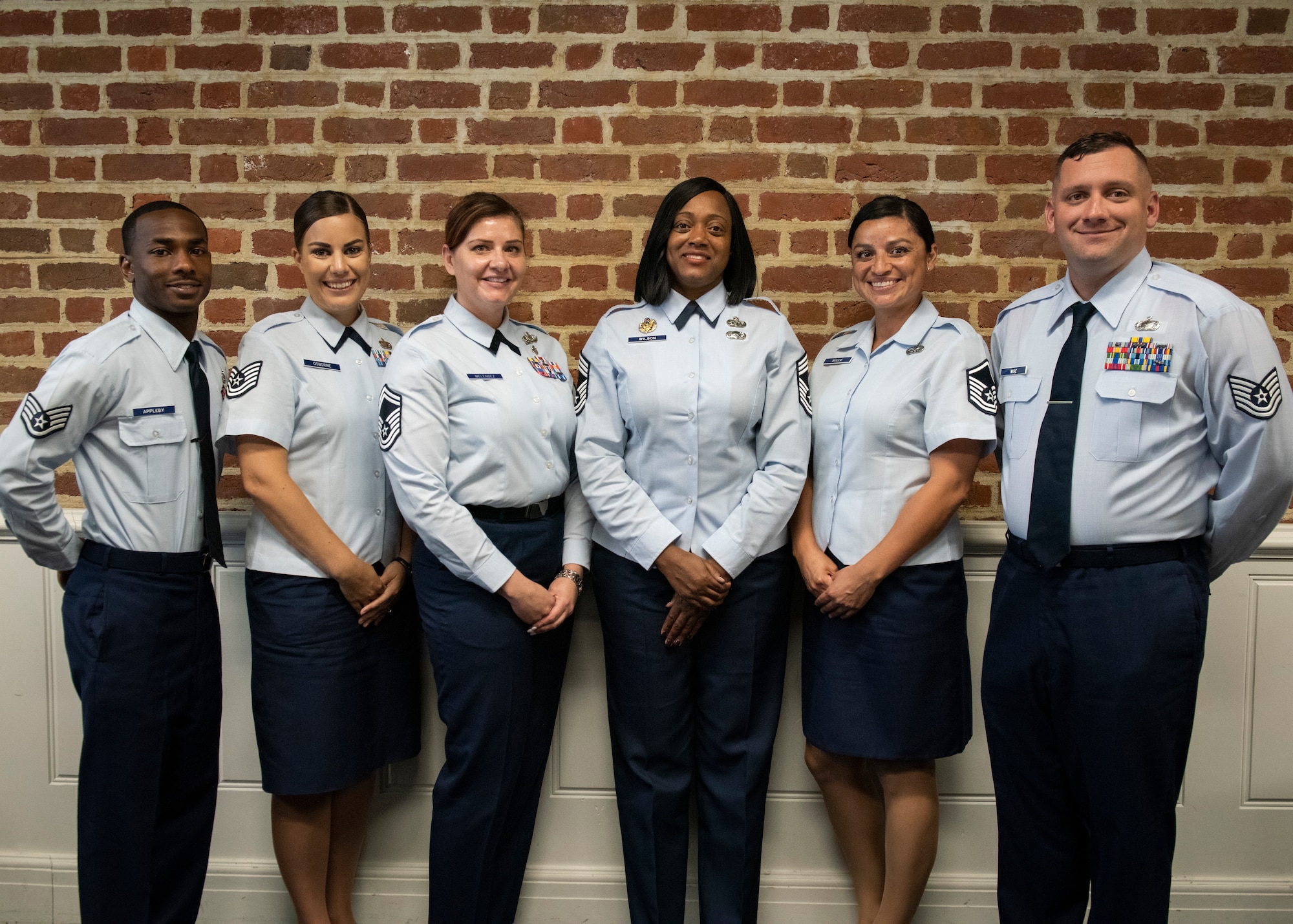 Technical Sgt. Amanda Osborne, 337th Air Support Flight flight chief (second from the left) takes a group photo with her 337th Air Support Flight team members Nov 21, 2019.