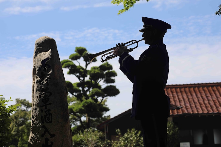 TSgt Matt Kirkpatrick sounds Taps for a memorial ceremony.