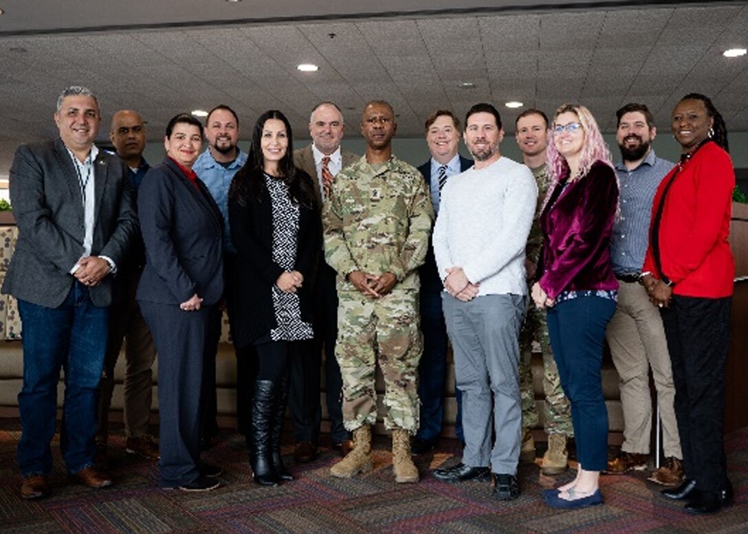 The U.S. Army Corps of Engineers' senior enlisted adviser Command Sgt. Maj. Patrickson Toussaint poses with the Jacksonville District Leadership Development Program team during a recent visit to the Jacksonville District February 16-17.