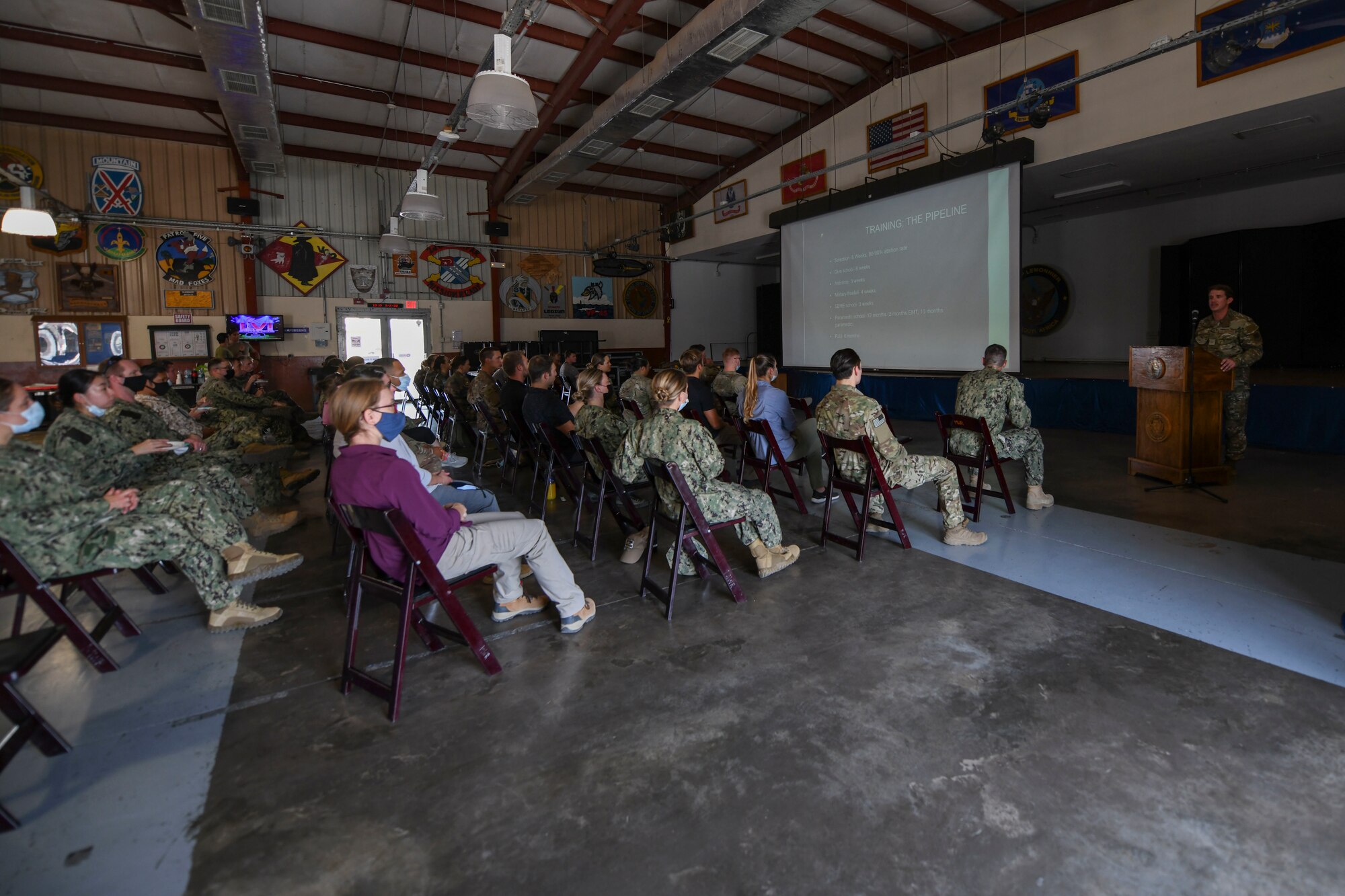 Senior Airman Cameron Ware, 82nd Expeditionary Rescue Squadron pararescuemen, briefs joint service members and allied partners during an international medical conference at Camp Lemonnier, Djibouti, Feb. 3, 2022. The 82nd ERQS pararescuemen are highly trained and equipped to conduct conventional rescue and recovery missions within Eastern and Northern Africa. (U.S. Air Force photo by Senior Airmen Ericka A. Woolever)