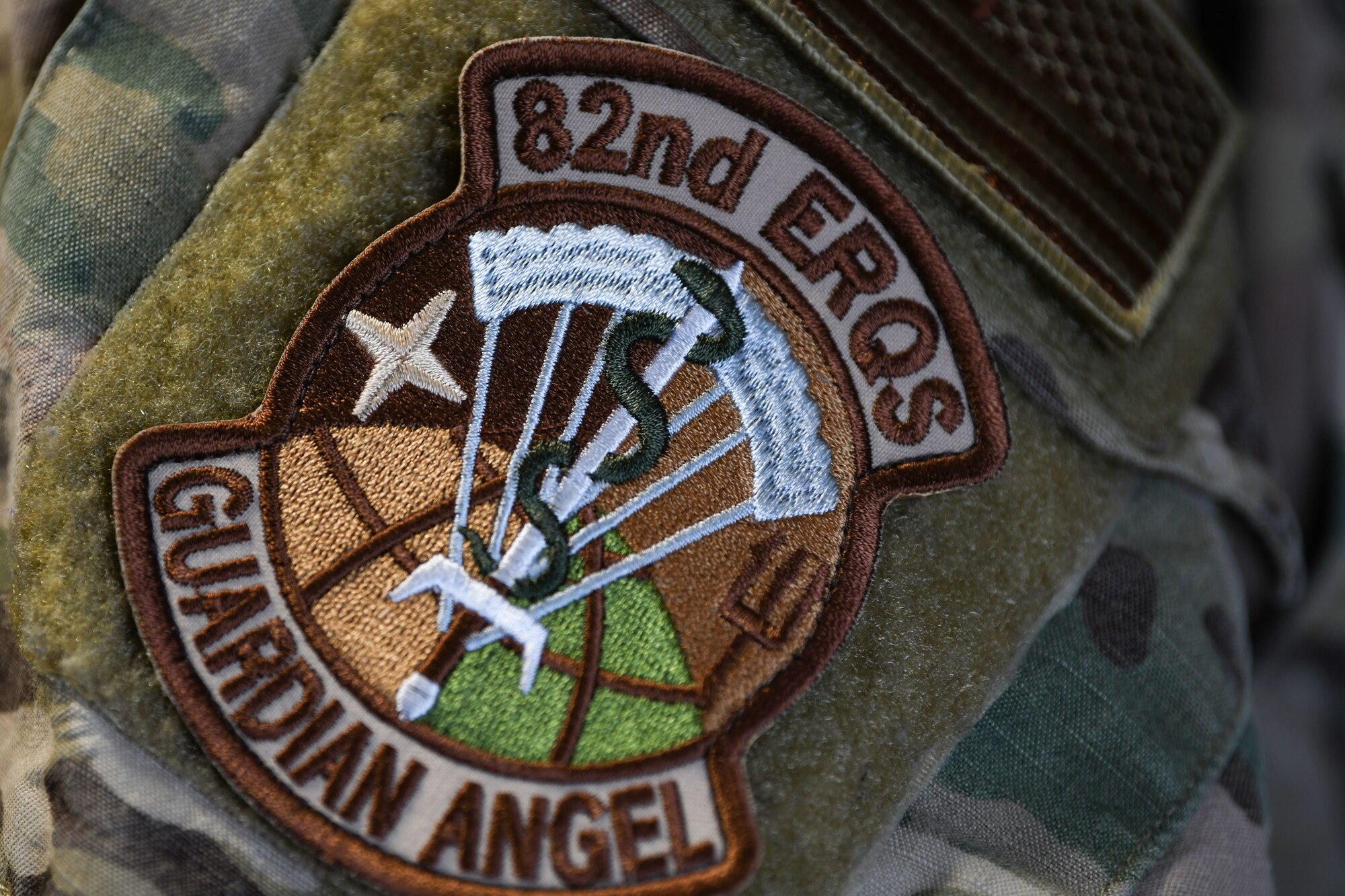 U.S. Air Force Captain Courtney M. Bailey, 82nd Expeditionary Rescue Squadron commander, wears a squadron patch at Camp Lemonnier, Djibouti, Feb. 3, 2022. The 82nd ERQS serves as U.S. Air Forces Africa’s Personnel Recovery liaison, coordinating efforts between coalition and joint forces in East Africa, enhancing combatant commands Warfighter Recovery Network. (U.S. Air Force photo by Senior Airmen Ericka A. Woolever)