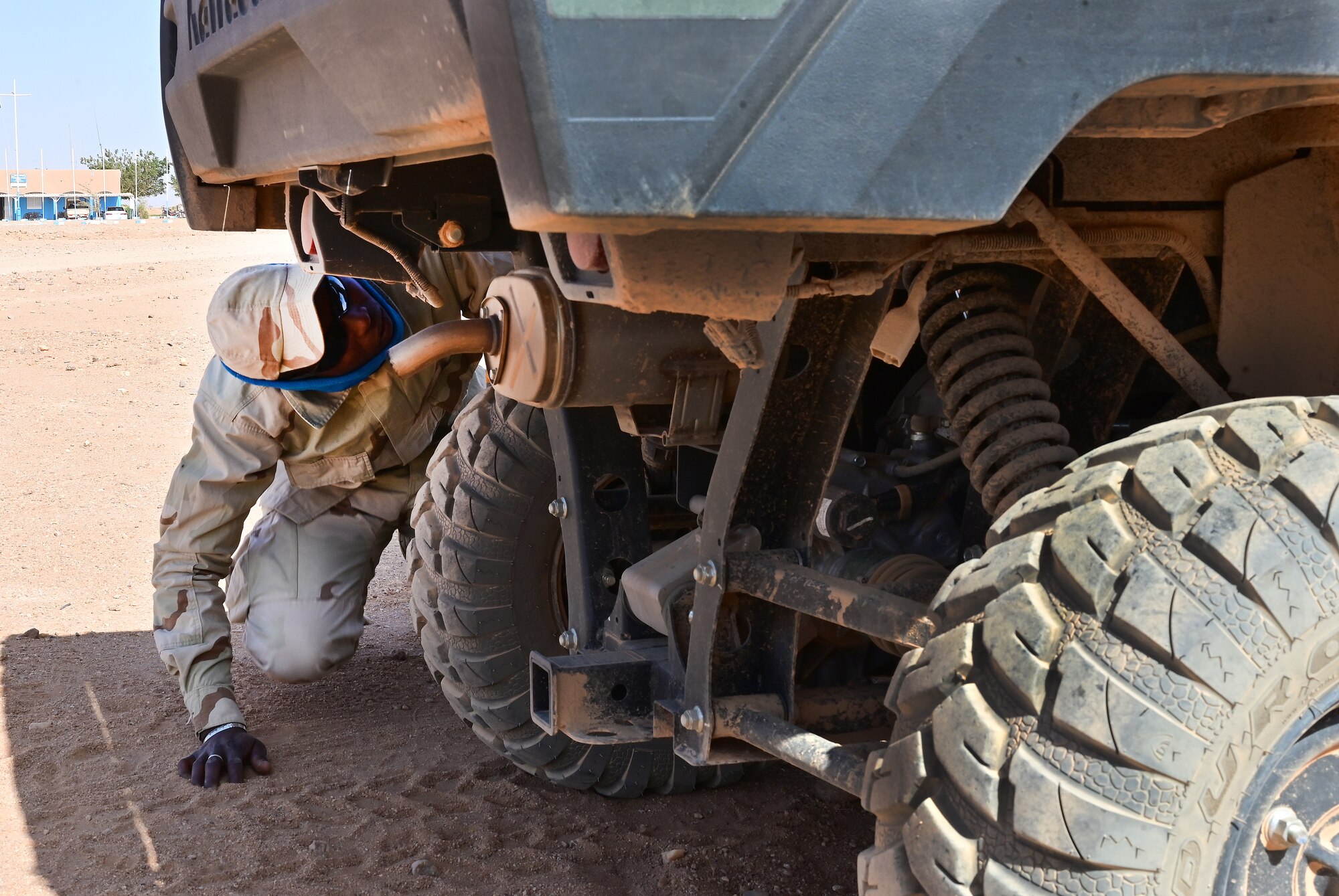 220217-F-EI771-0142
A Niger Armed Forces (French language: Forces Armées Nigeriennes) member searches a vehicle during a training event at Nigerien Air Base 201, Agadez, Niger, Feb. 17, 2022. Vehicle searches are part of an eight-week military operations course taught by 409th Expeditionary Security Forces Squadron air advisors to strengthen defense capabilities, while enhancing the long-standing military-to-military U.S. and Niger partnership. Training alongside our African partners forges strategic relationships, and builds the operational confidence to cohesively join forces anytime, anywhere. (U.S. Air Force photo by Tech. Sgt. Stephanie Longoria)