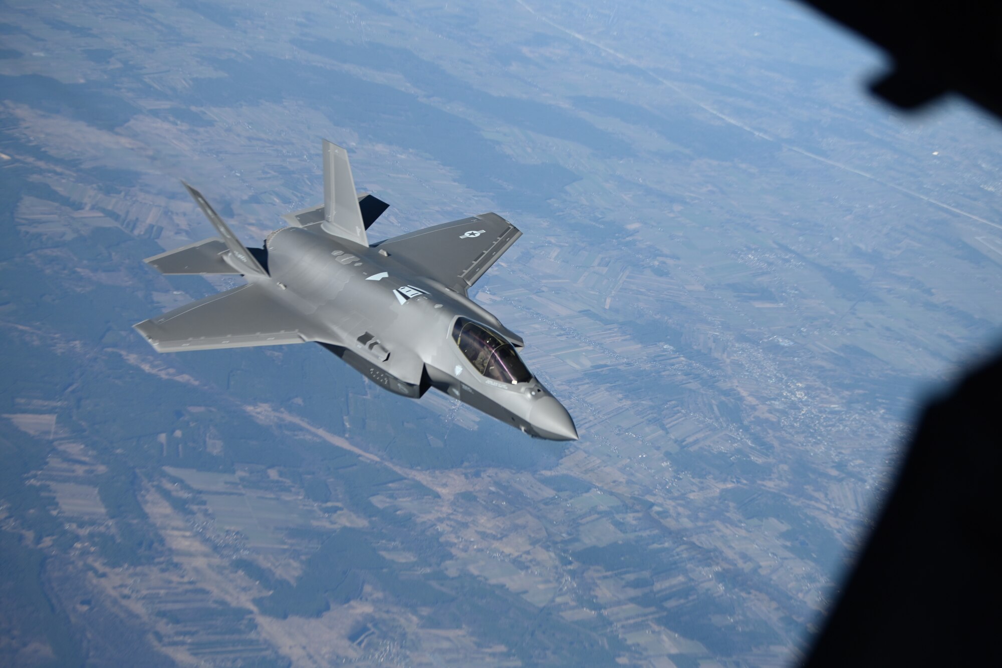 A U.S. Air Force F-35 Lightning II aircraft assigned to the 34th Fighter Squadron departs from a KC-10 Extender aircraft after receiving fuel over Poland, Feb. 24, 2022. U.S. Air Forces in Europe and Air Forces Africa’s ability to support and integrate with NATO’s air policing missions continually hardens the alliance’s solidarity, collective resolve, and ability to adapt to a dynamic war fighting environment. (U.S. Air Force photo by Senior Airman Joseph Barron)