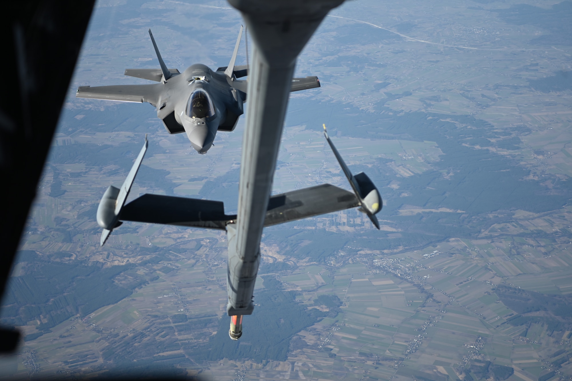 A U.S. Air Force F-35 Lightning II aircraft assigned to the 34th Fighter Squadron approaches a KC-10 Extender aircraft to receive fuel over Poland, Feb. 24, 2022. The F-35s, originally from Hill Air Force Base, Utah, are forward deployed to NATO’s eastern flank to support NATO’s Enhanced Air Policing mission. (U.S. Air Force photo by Senior Airman Joseph Barron)