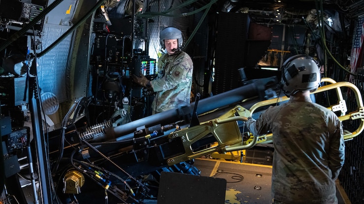 U.S. Air Force Staff Sgt. Jedediah Parks and Senior Airman Sean Curtin, 16th Special Operations Squadron AC-130W Stinger II aerial gunners, operate an M137A1 105mm artillery cannon during live fire training over Spirit live fire range at Melrose Air Force Range, New Mexico, Jan. 31, 2022. The 16 SOS conducted a memorial flyover honoring Spirit 03, the last AC-130 gunship to be shot down during combat. The squadron also held a remembrance brief after the flights detailing the story of the aircrew and advancements made as a result of the loss of Spirit 03. (U.S. Air Force photo by Airman 1st Class Drew Cyburt)