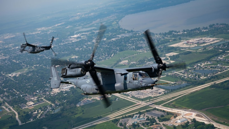 U.S. Air Force 1st Special Operations Wing CV-22 Ospreys from Hurlburt Field, Fla., and a 27th Special Operations Wing MC-130J Commando II from Cannon Air Force Base, N.M., perform a tilt-rotor air to air refueling demonstration during EAA AirVenture Oshkosh 2021, over Wittman Regional Airport, Wis., Aug. 1, 2021. Air Force Special Operations Command was featured at EAA’s airshow and brought multiple aircraft in its inventory to include the AC-130J Ghostrider, MC-130J Commando II, EC-130J Commando Solo, CV-22 Osprey, C-145 Combat Coyote, U-28 Draco, C-146 Wolfhound, MC-12 Liberty,  and the MQ-9 Reaper displaying capabilities of airpower through aerial demonstrations and/or static displays. (U.S. Air Force photo by Staff Sgt. Peter Reft.)