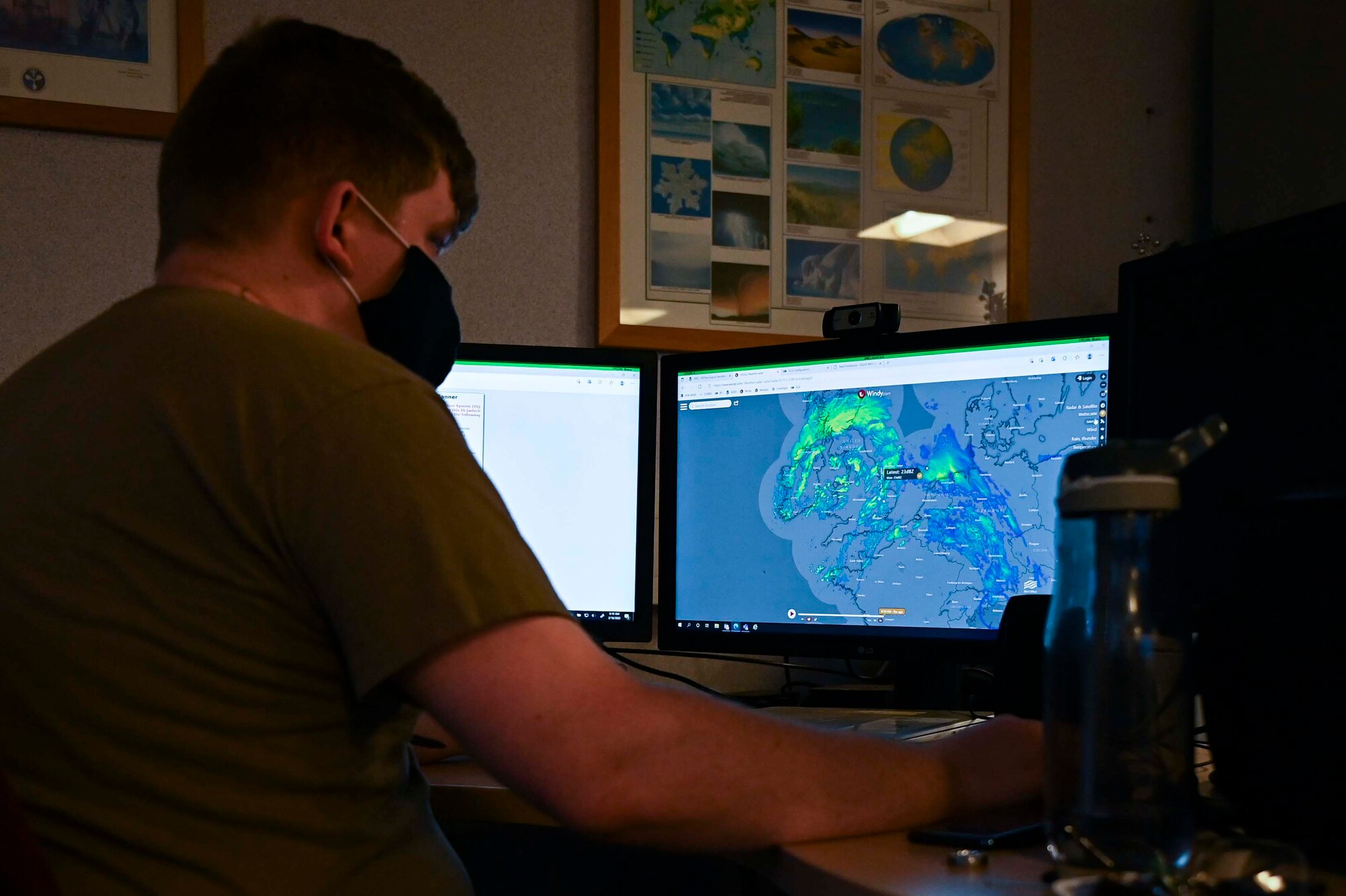 U.S. Air Force Staff Sgt. Mitchell Thompson, 100th Operations Security Squadron weather technician, interacts with a forecast predicting weather patterns over southeastern England, Royal Air Force Mildenhall, England, Feb. 18, 2021. The weather flight utilizes an integrated system of weather sensors that measure, collect, and disseminate meteorological data. (U.S. Air Force photo by Airman 1st Class Viviam Chiu)