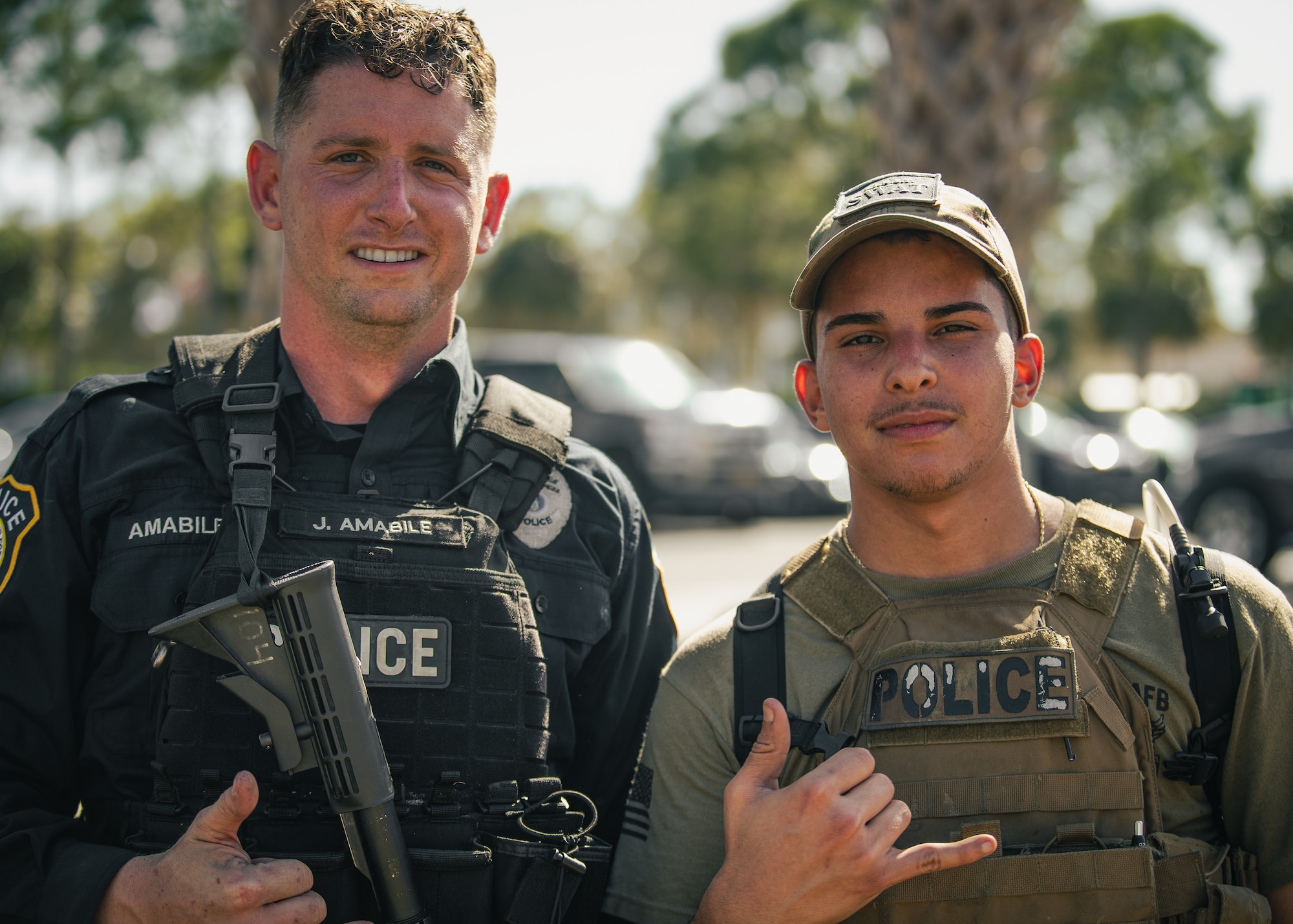 Joseph Amabile, 6th Security Forces Squadron (SFS) patrolman, and U.S. Air Force Senior Airman Jediath Lopez-Borrero, 6th SFS alarm monitor, pose for a photo following the Emergency Services Team (EST) tryouts at MacDill Air Force Base, Florida, Feb. 4, 2022.