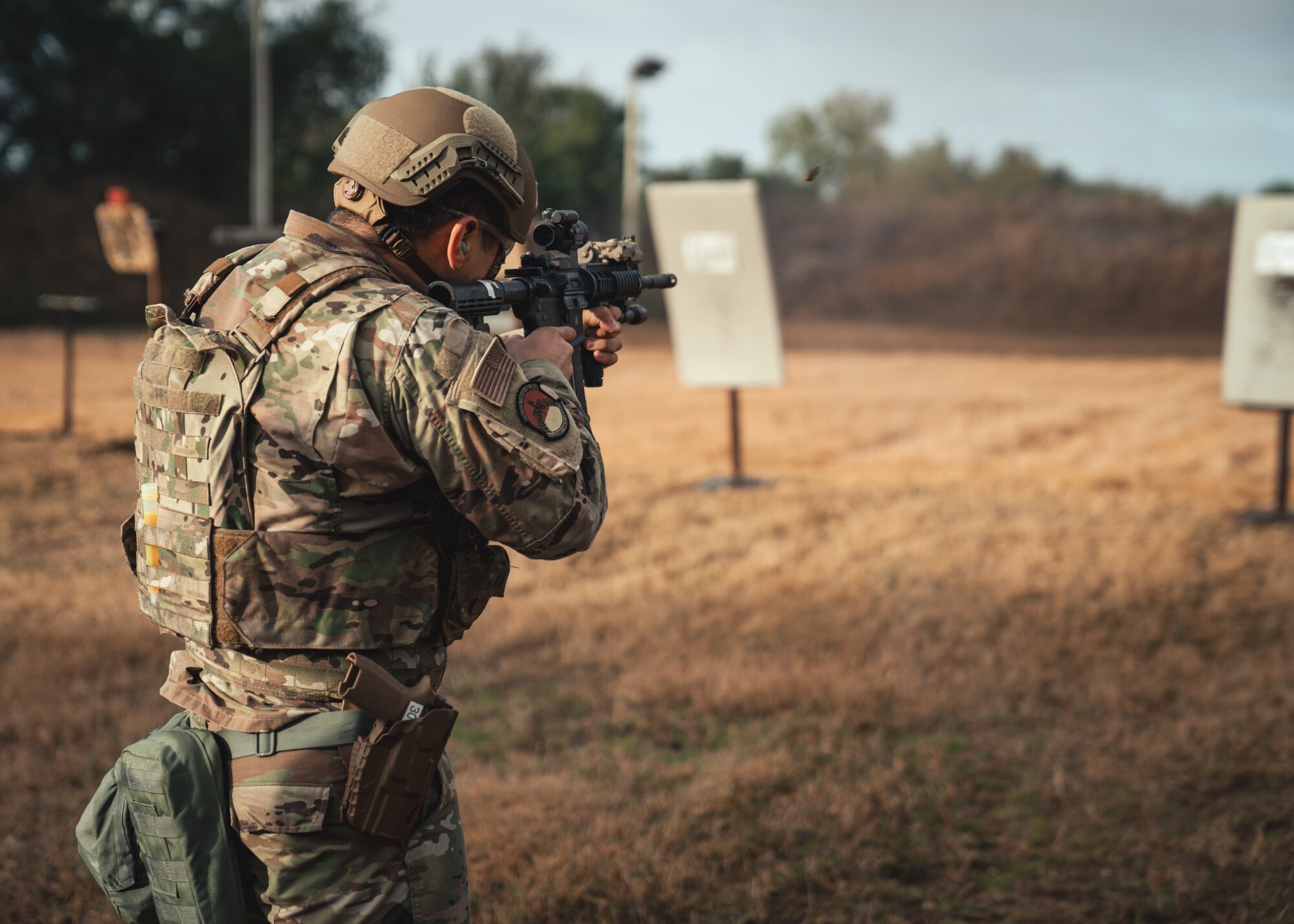 U.S. Air Force Airman 1st Class Yazin Gasga, 6th Security Forces Squadron entry controller, fires his weapon during Emergency Services Team (EST) tryouts at MacDill Air Force Base, Florida, Feb. 4, 2022.