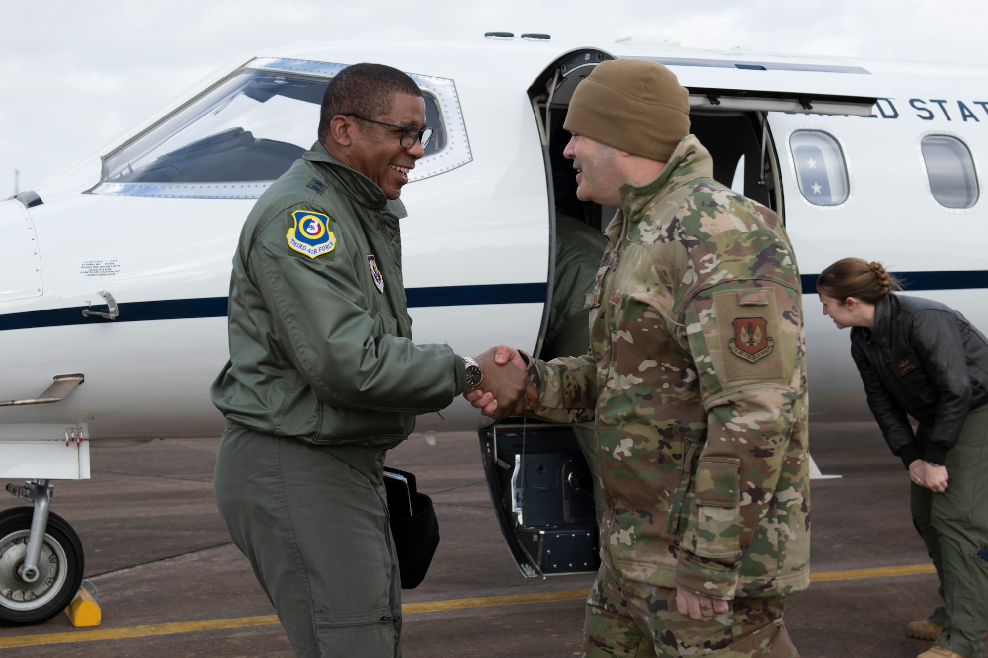 U.S. Air Force Maj. Gen. Randall Reed, left, Third Air Force commander, greets Col. Brian Filler, right, 501st Combat Support Wing commander, at RAF Fairford, England, Feb. 21, 2022. Reed and several dignitaries from allied nations were at Fairford to participate in briefings about the capabilities and operations of U.S. Air Forces in the U.K. (U.S. Air Force photo by Senior Airman Jennifer Zima)