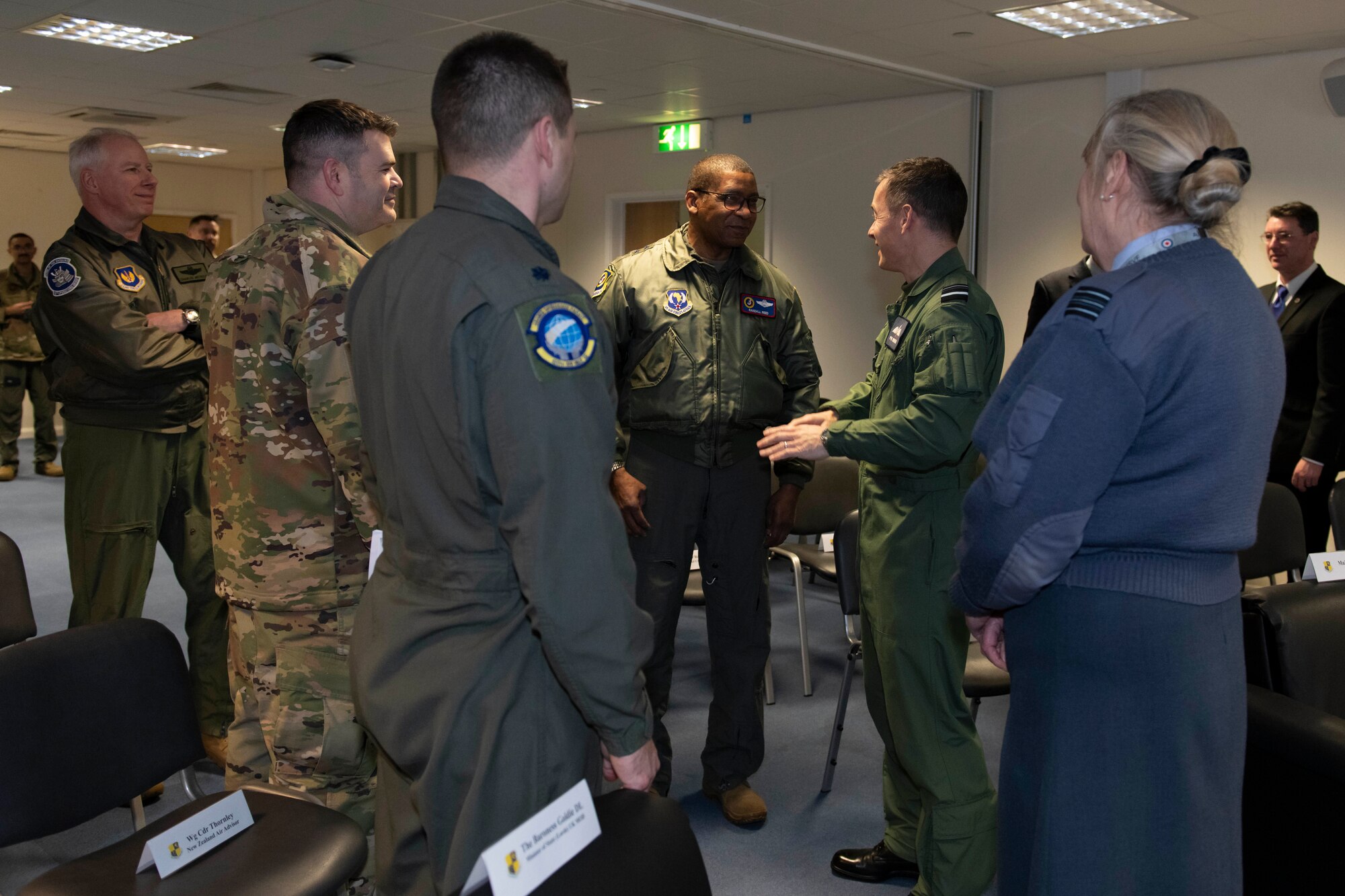 U.S. Air Force Maj. Gen. Randall Reed, center left, Third Air Force commander, greets Royal Air Force Air Vice-Marshall Phil Robinson CBE DFC, center right, Air Officer Commanding No. 11 Group, at RAF Fairford, England, Feb. 21, 2022. Reed was at Fairford to participate in briefings with representatives from allied nations about the capabilities and operations of U.S. Air Forces in the United Kingdom. (U.S. Air Force photo by Senior Airman Jennifer Zima)