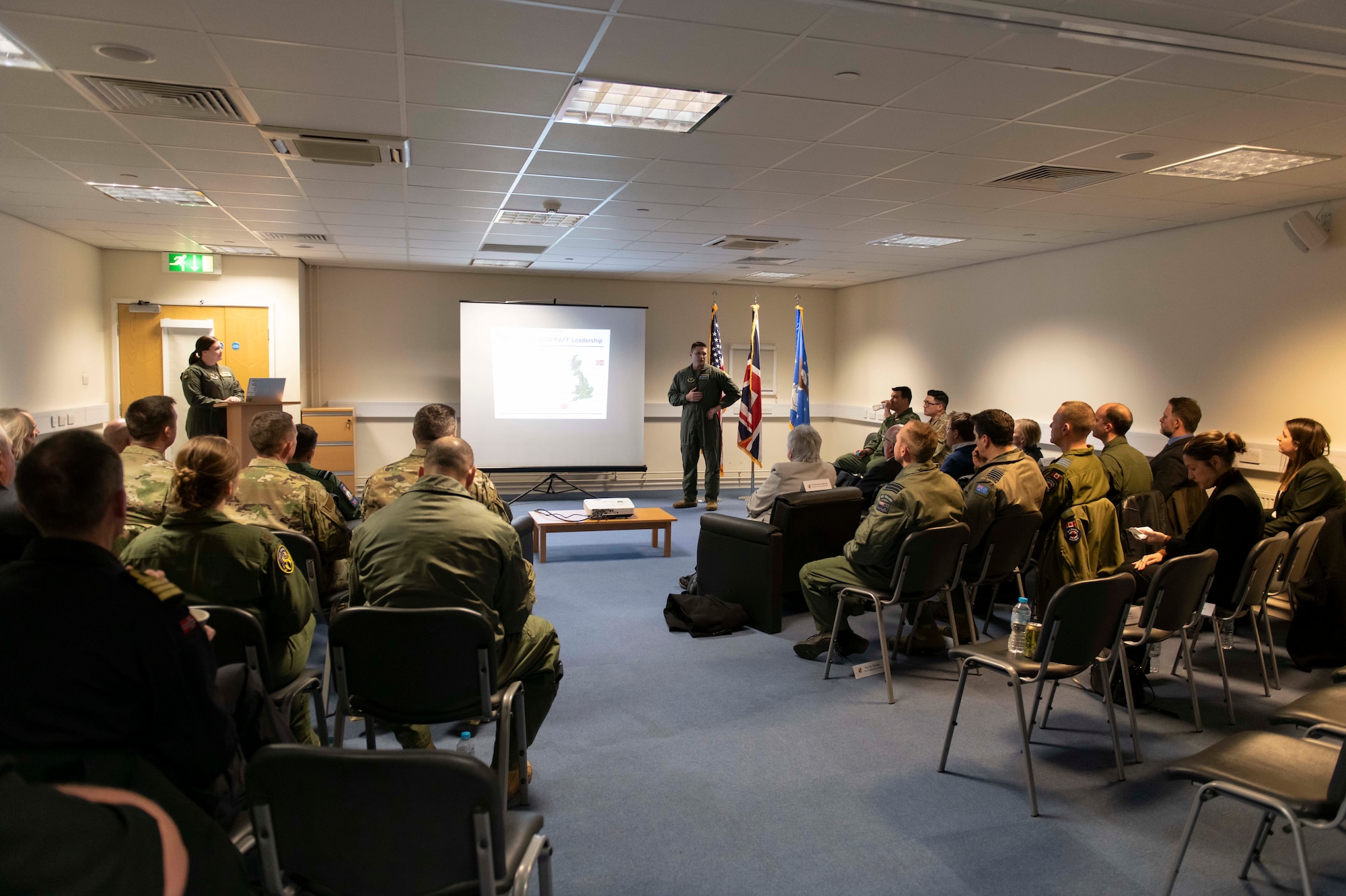 U.S. Air Force Lt. Col. Jeremy Stover, center left, 420th Air Base Squadron and 420th Expeditionary Air Base Squadron commander, welcomes distinguished visitors to RAF Fairford, England, Feb. 21, 2022. The tour these dignitaries and guests were on was meant to give representatives from allied nations insights into the capabilities and operations of U.S. Air Forces in the United Kingdom. (U.S. Air Force photo by Senior Airman Jennifer Zima)